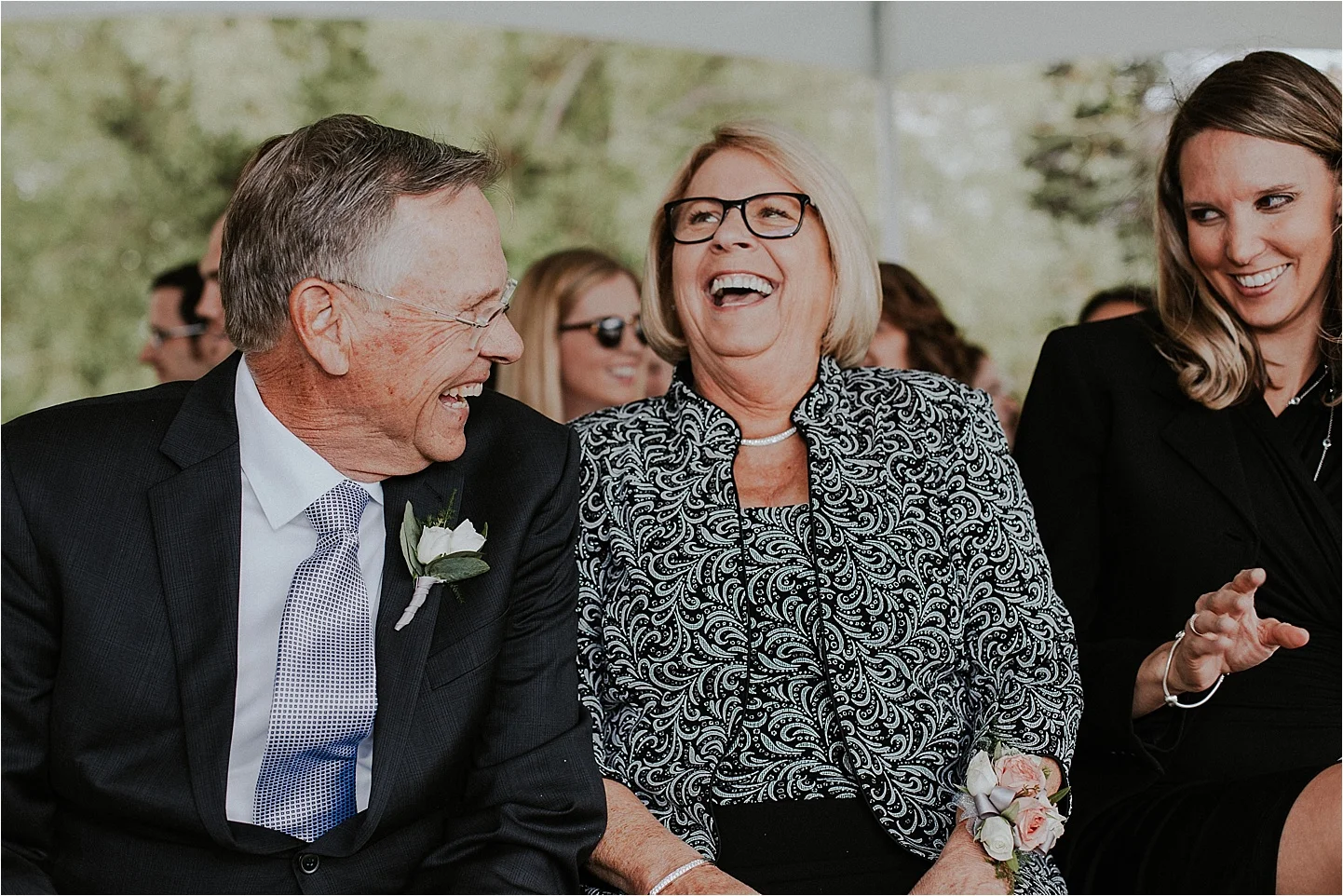 whitefish montana wedding guests laughing.jpg