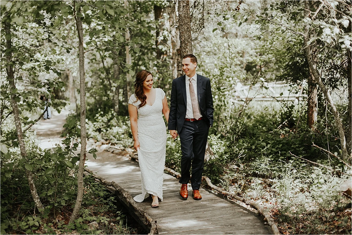 whitefish montana wedding walking through the forest.jpg