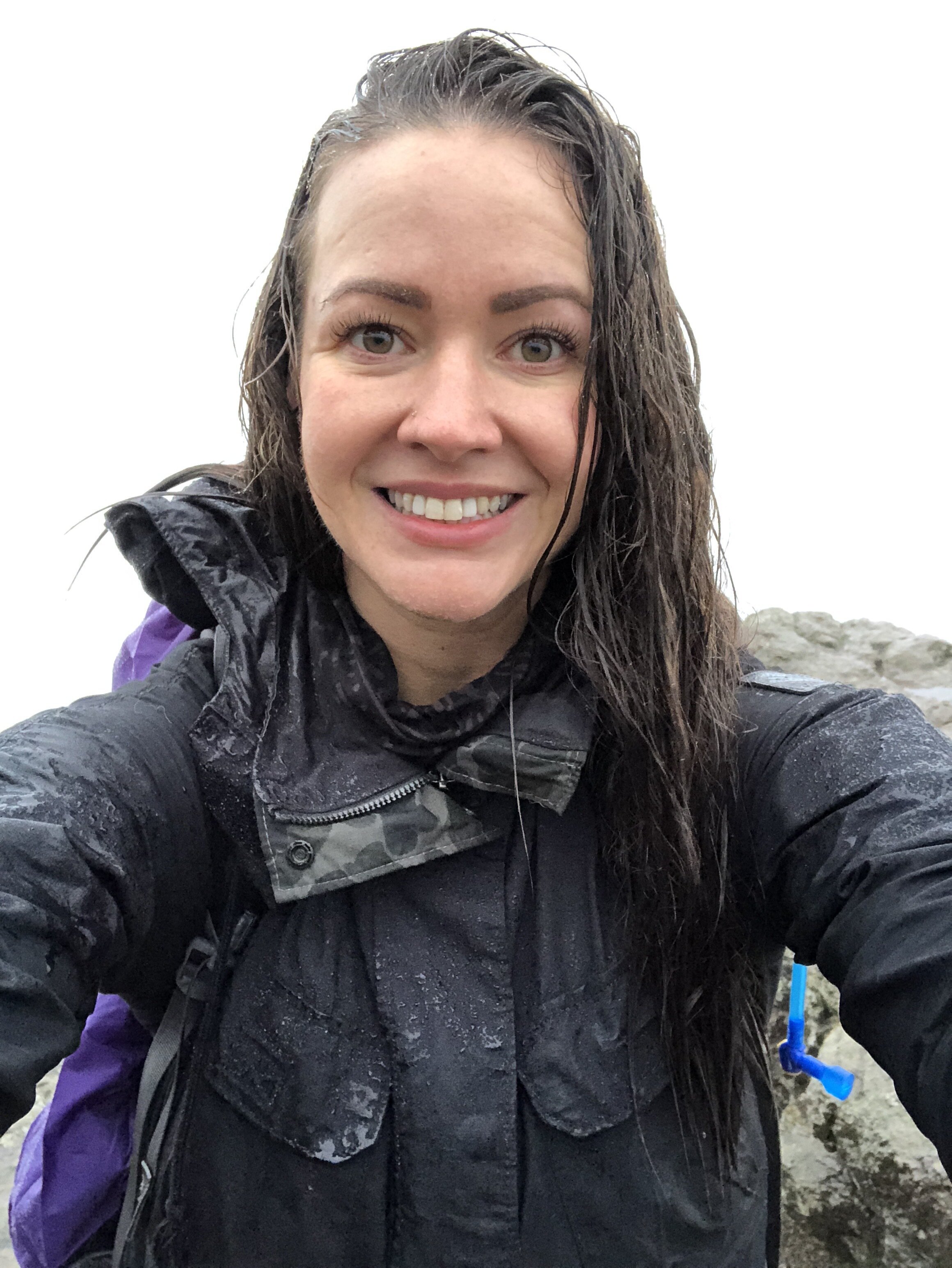  Mount Rainier wedding photographer, Jessi Cavey,&nbsp;hikes through rainy Washington weather. 