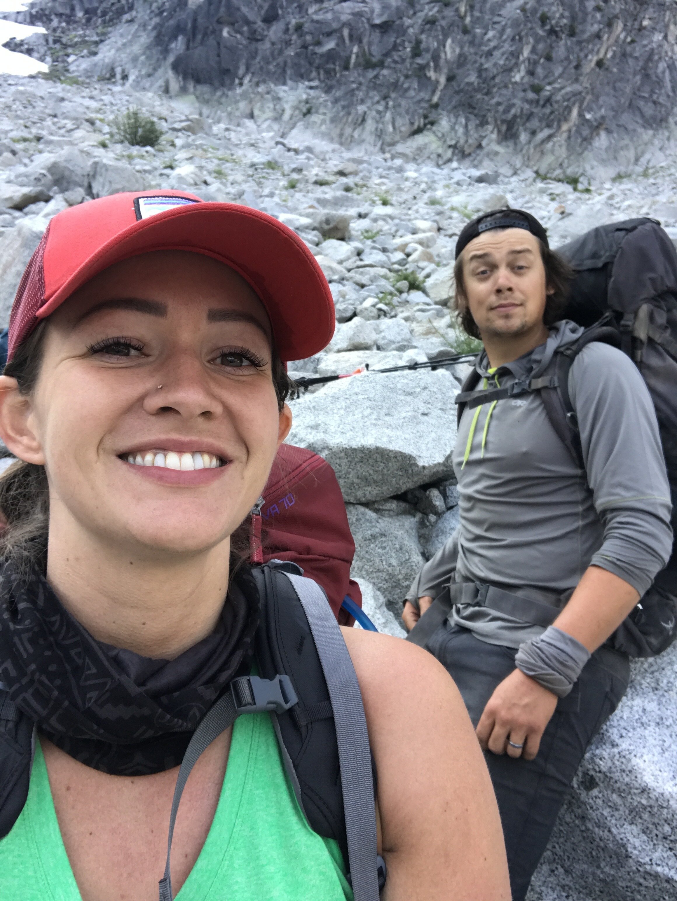  Mount Rainier wedding photographer, Jessi Cavey, hikes with friend up Aasgard Pass in Washington. 