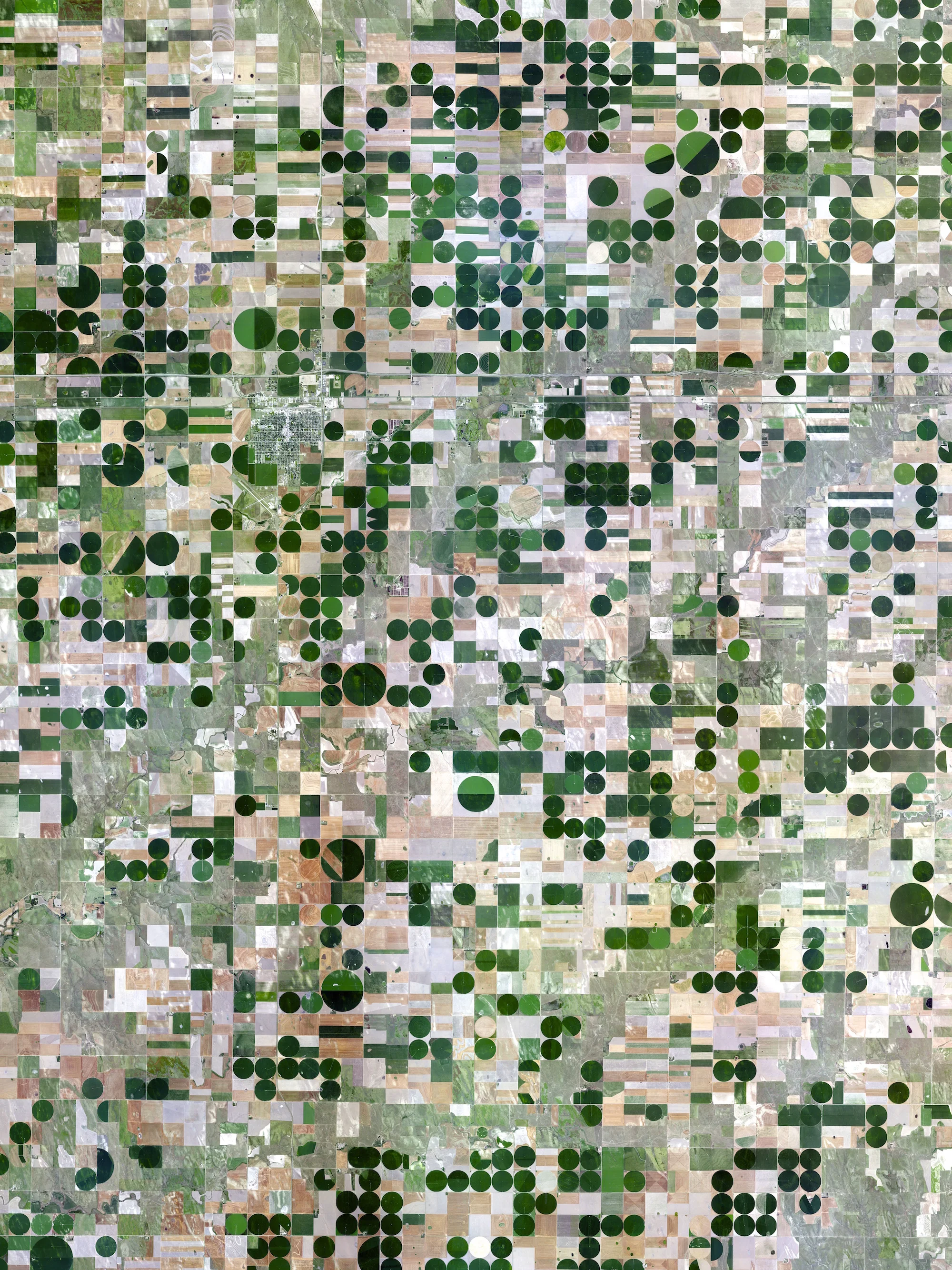 5/8/2015 Pivot irrigation Kansas, USA 39°20′14″N 101°32′26″W To celebrate the weekend (and to thank you for all for helping us hit the 35k follower milestone!), we wanted to have our first Printshop giveaway. Simply tag three friends on our Instagram feed to be entered to win a 7.5” x 10” print of these pivot irrigation fields in Kansas. The circles that you see are created when lines of sprinklers that are powered by electric motors rotate 360 degrees to evenly irrigate crops. A winner will be randomly selected in 48 hours. Thanks!