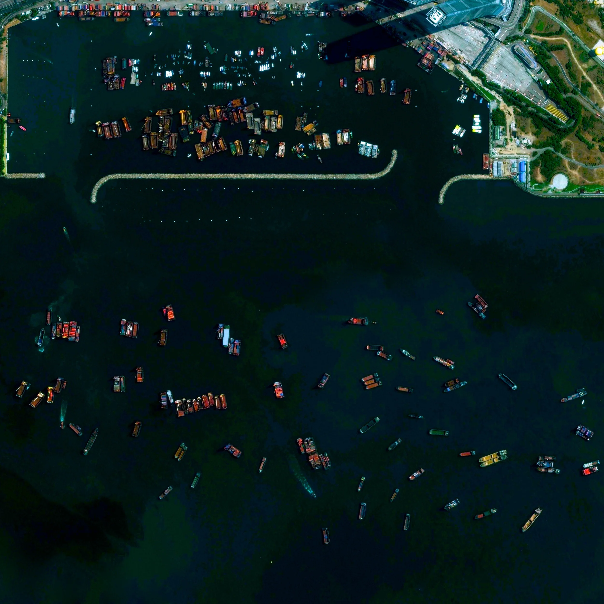 5/28/2015 Yau Ma Tei Typhoon Shelter Kowloon, Hong Kong 22.3099°N 114.1570°E The Yau Ma Tei Typhoon Shelter is located in Kowloon, Hong Kong. During the massive storms that frequently strike the region, fishing boats are protected from gale force winds and rough seas behind the man-made breakwater.