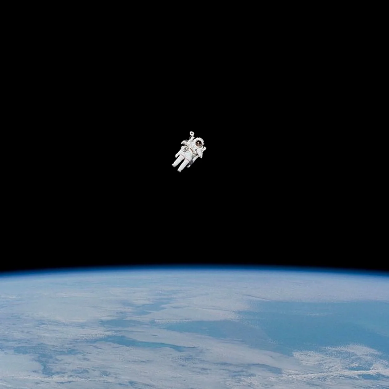 We are definitely feeling the Overview Effect in this photograph taken of Bruce McCandless II by his fellow crewmembers aboard the Earth-orbiting Space Shuttle Challenger on February 7, 1984. At this stage in his mission, he was approaching his maximum distance from the vehicle. The first American to conduct a spacewalk was astronaut Edward H. White II when he floated into the vastness of space on June 3, 1965. Credit: NASA