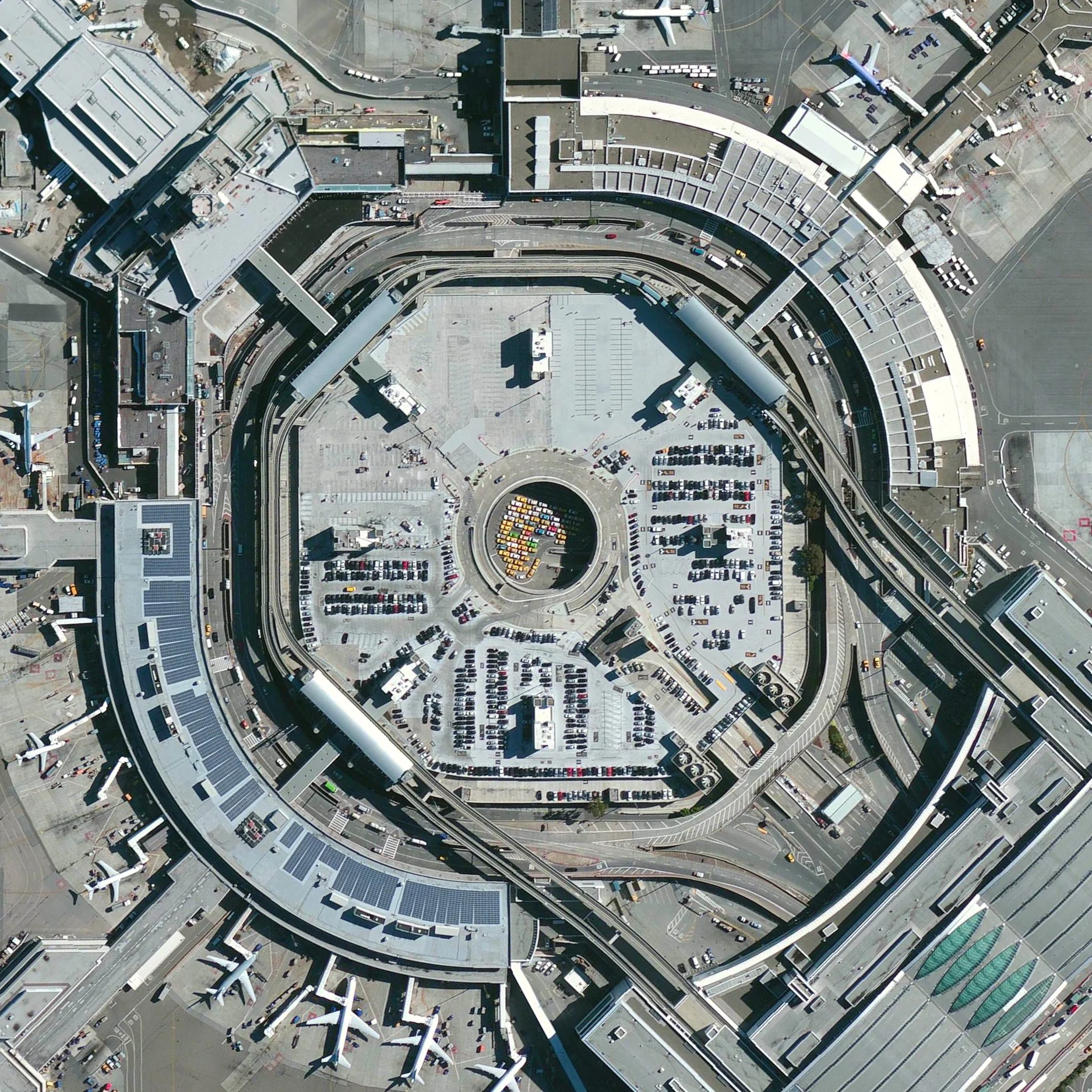 6/13/2015 San Francisco International Airport San Francisco, California, USA 37°37′08″N 122°22′30″W A colorful taxi line is visible through an opening in the roof of the parking garage at San Francisco International Airport. SFO is the twenty-first busiest airport in the world by passenger count, accommodating more than 50 million passengers each year.
