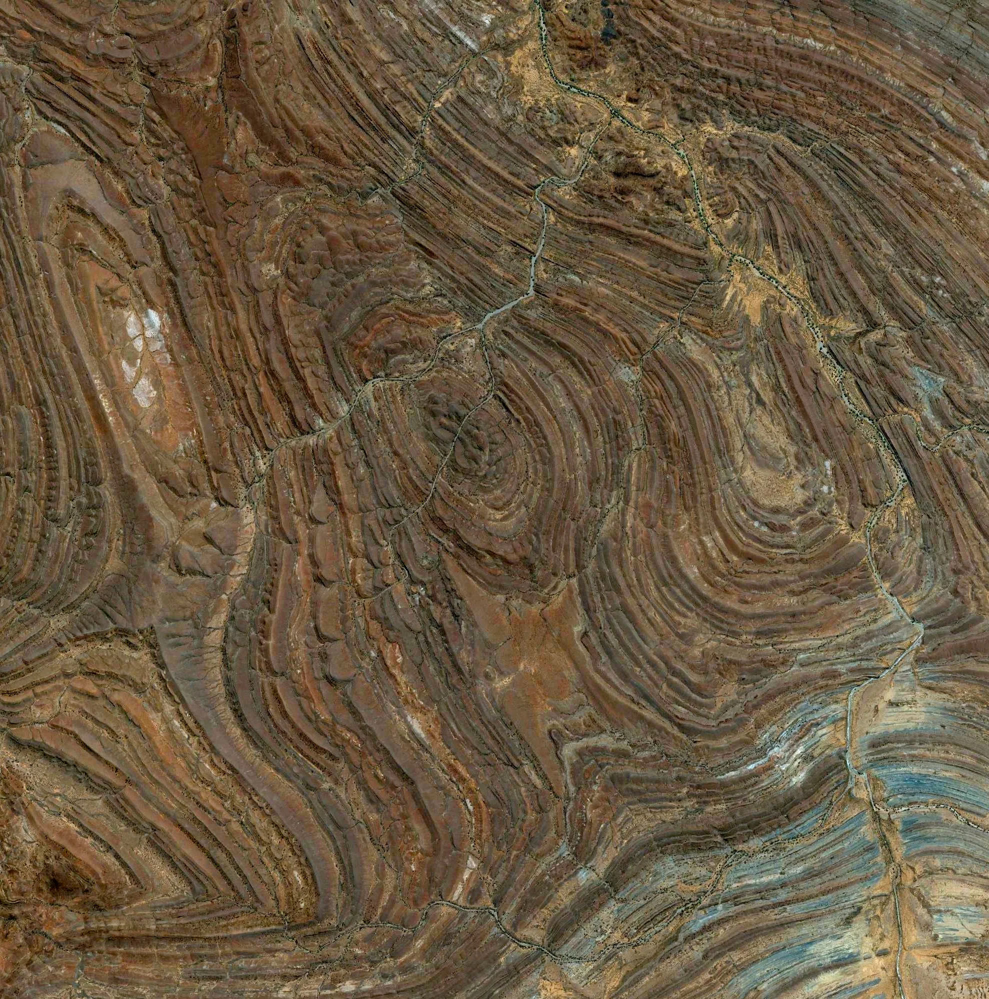6/15/2015 Adelaide Rift Complex South Australia, Australia -29.791018049°, 137.823068752° Rock formations of the Adelaide Rift Complex are visible in the South Australian Outback. The swirling patterns are composed of folded and faulted sediments that were deposited there in a large basin more than 540 million years ago. Since then, the land folded and faulted to become a large mountain range and then underwent extensive erosion to become the relatively low ranges that we see today. For a sense of scale, this Overview is approximately 100 square miles.