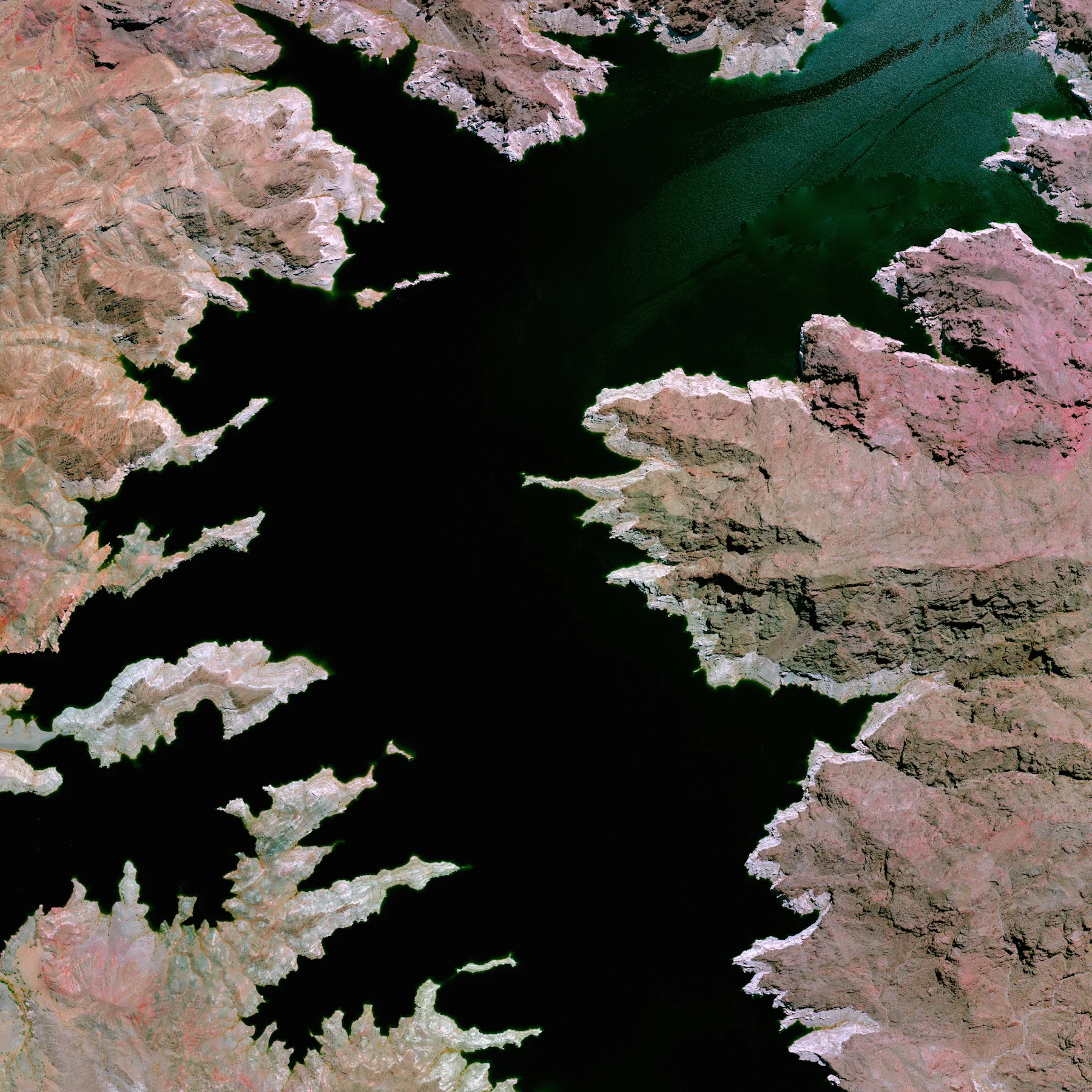 6/25/2015 Lake Mead Mohave County, Arizona / Clark County, Nevada 36.25°N 114.39°W Lake Mead—located on the Colorado River 24 miles southeast of Las Vegas, Nevada—is the largest reservoir in the United States. The lake was formed with the creation of the Hoover Dam in the 1930’s. Due to a combination of drought and increased water demand in the surrounding states (specifically California, Nevada, New Mexico, and Arizona) the lake’s water level is lowering drastically. Yesterday, water levels at the lake reached a record low of 1075 feet, only 25 feet above one of the major intake pipes for Las Vegas’ supply of drinking water.