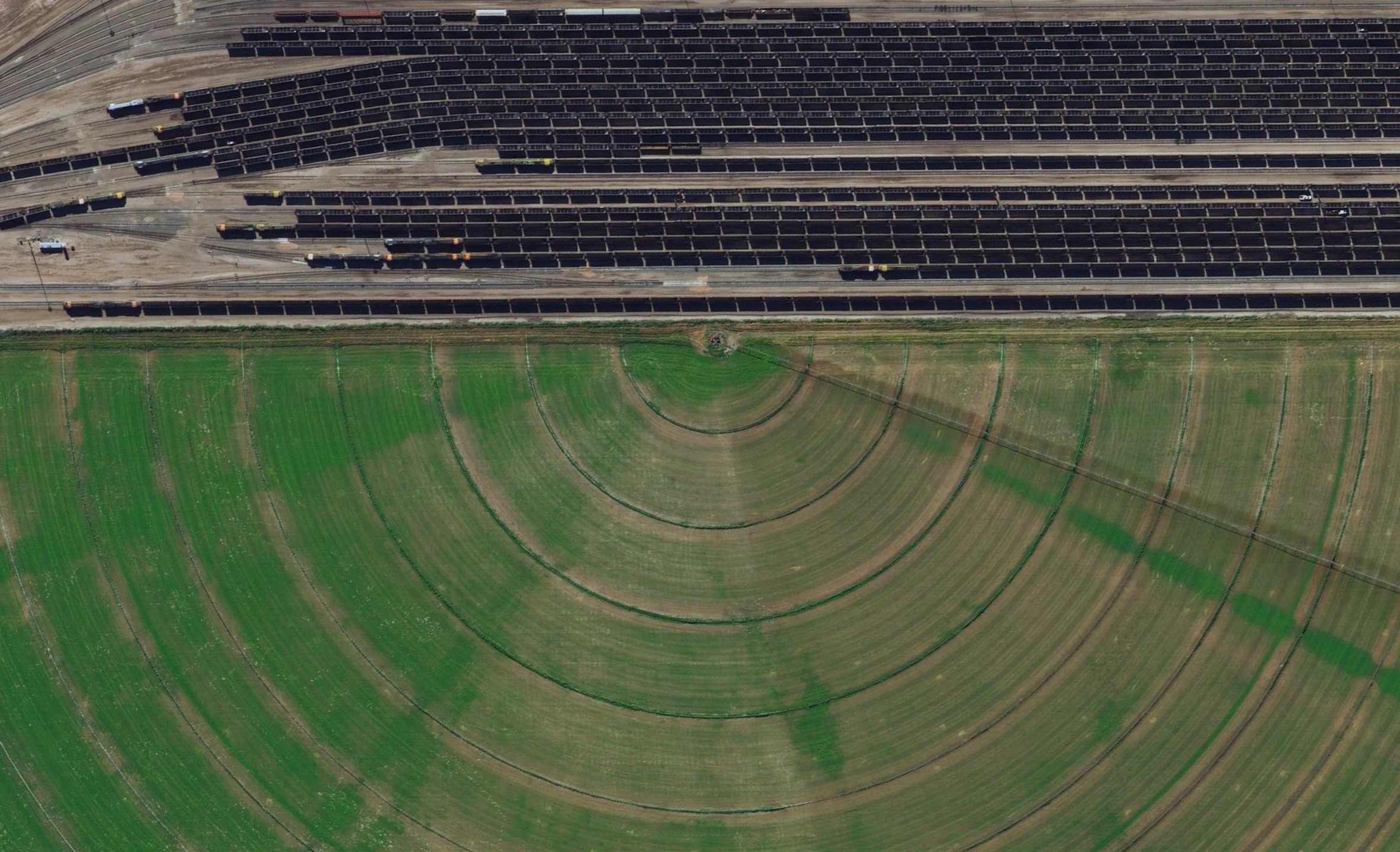 7/15/2015 Coal trains Alliance, Nebraska, USA 42.082523321°, -102.890045721° Coal trains - some full, others empty - idle in a railyard next to a pivot irrigation circle in Alliance, Nebraska, USA. The city is located in the Powder River Basin - one of the world’s largest coal-mining areas - and serves as a stopping point for trains en route to power plants in the Midwest and Southern parts of the country.