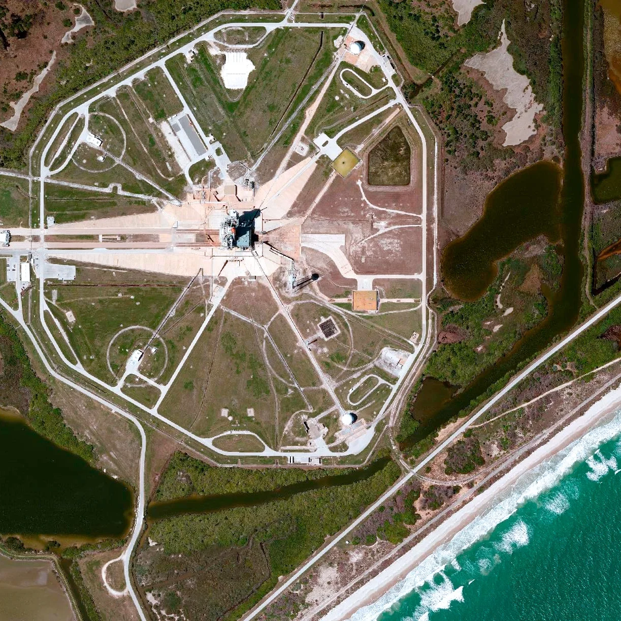 7/20/2015 Launch Pad 39A Merritt Island, Florida, USA 28.607922683°, -80.603835567° Today marks the 46th anniversary of the moon landing by NASA's Apollo 11. A Saturn V rocket launched the mission from Launch Pad 39A at the Kennedy Space Center in Merritt Island, Florida, USA on July 16th, 1969. That specific site is scene here. After traveling 240,000 miles in 76 hours, Apollo 11 entered into a lunar orbit on July 19. The next day, at 10:56 p.m., Neil Armstrong stepped off the ladder of the Lunar Module onto the moon’s surface and famously remarked “that’s one small step for a man, one giant leap for mankind.”