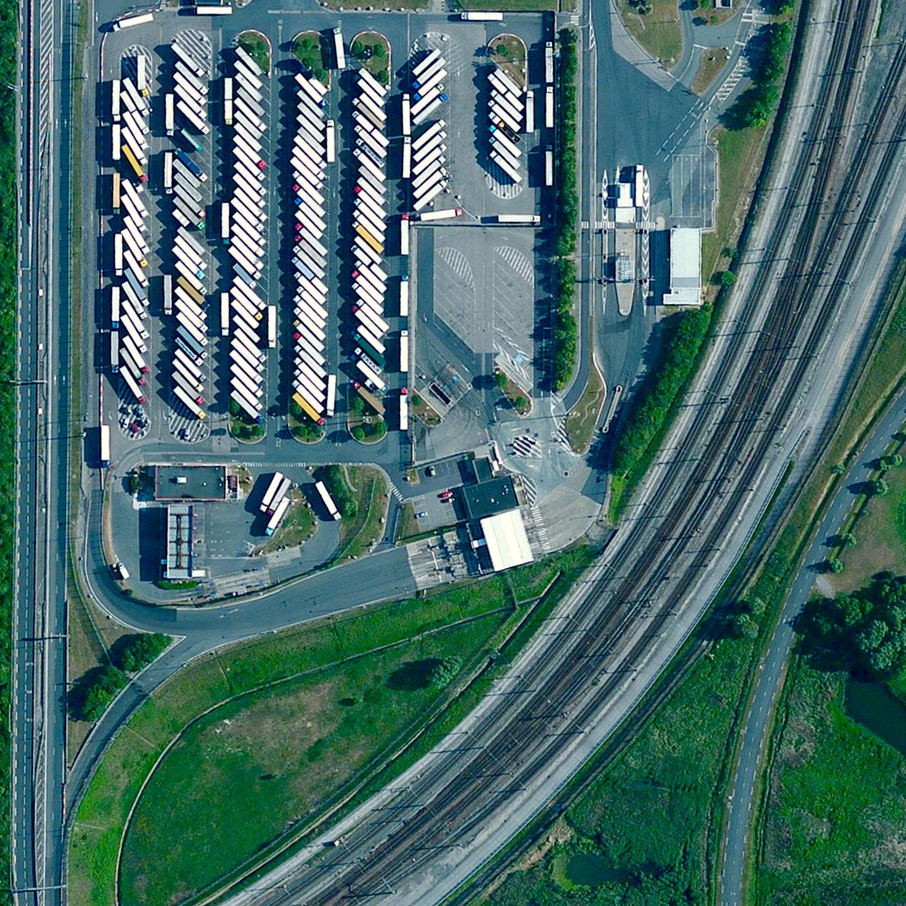 7/29/2015 Trucks at Channel Tunnel Calais, France 50.931745288°, 1.824167808° Trucks sit by the entrance of the Channel Tunnel in Calais, France. Last night more than 2,200 migrants attempted to break into the tunnel entrance in an effort to get to Britain - 31.4 miles away via the underwater passage. This is the latest incident in an ongoing crisis in Europe where an estimated 100,000 migrants have entered the continent to flee violence and poverty in neighboring regions.
