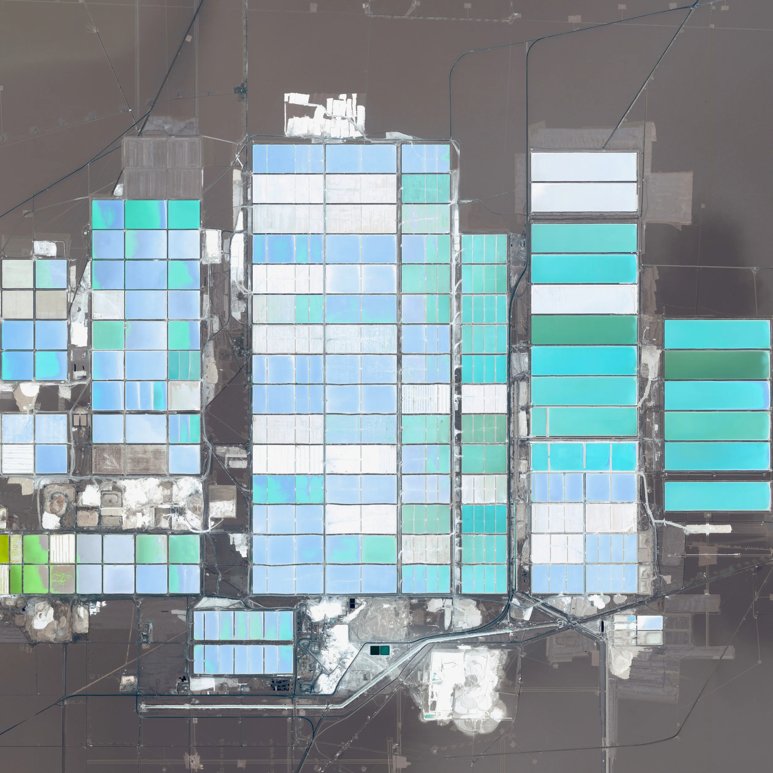 9/16/2015 Soquimich Lithium Mine Atacama Desert, Chile 23°28'55"S 68°19'51"W The Soquimich Lithium Mine is located in the Atacama Desert of Chile. With no historical record of rainfall in parts of the region, it is considered to be one of the driest places on Earth. Mineral-rich brines —water with a high percentage of dissolved salts — are pumped via underground wells into large, shallow ponds that are colored to speed up the evaporation process. The subsurface brines of the Atacama are particularly rich in lithium salts, an essential component of batteries and certain medicines.