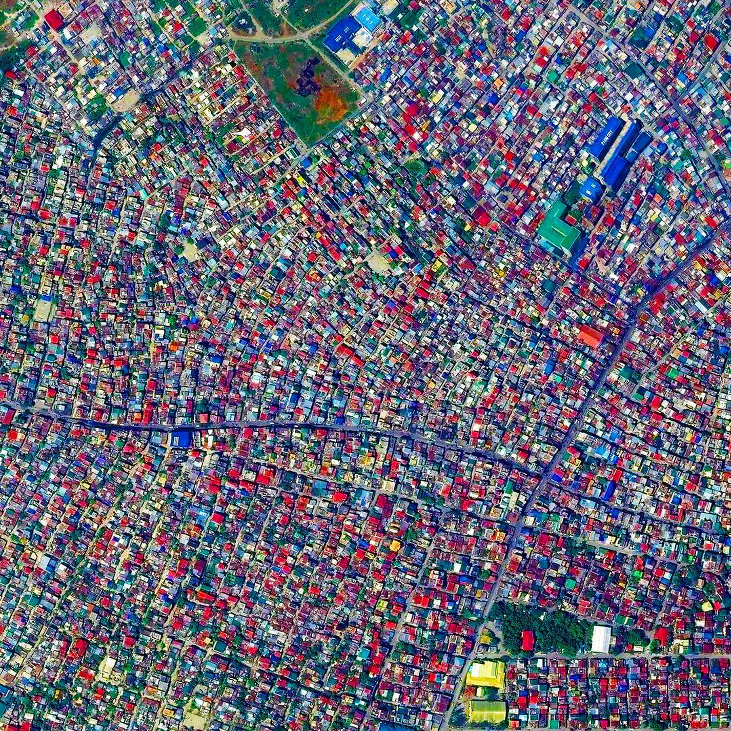 9/17/2015 Pasig Manila, Philippines 14.541245999°, 121.104281301° The City of Pasig is one of the highly urbanized areas in Manila, Philippines. Formerly a rural settlement, the city now contains mostly residential and industrial buildings and has been becoming increasingly commercial in recent years. The colorful roofs that dot the landscape are common in the Manila region.