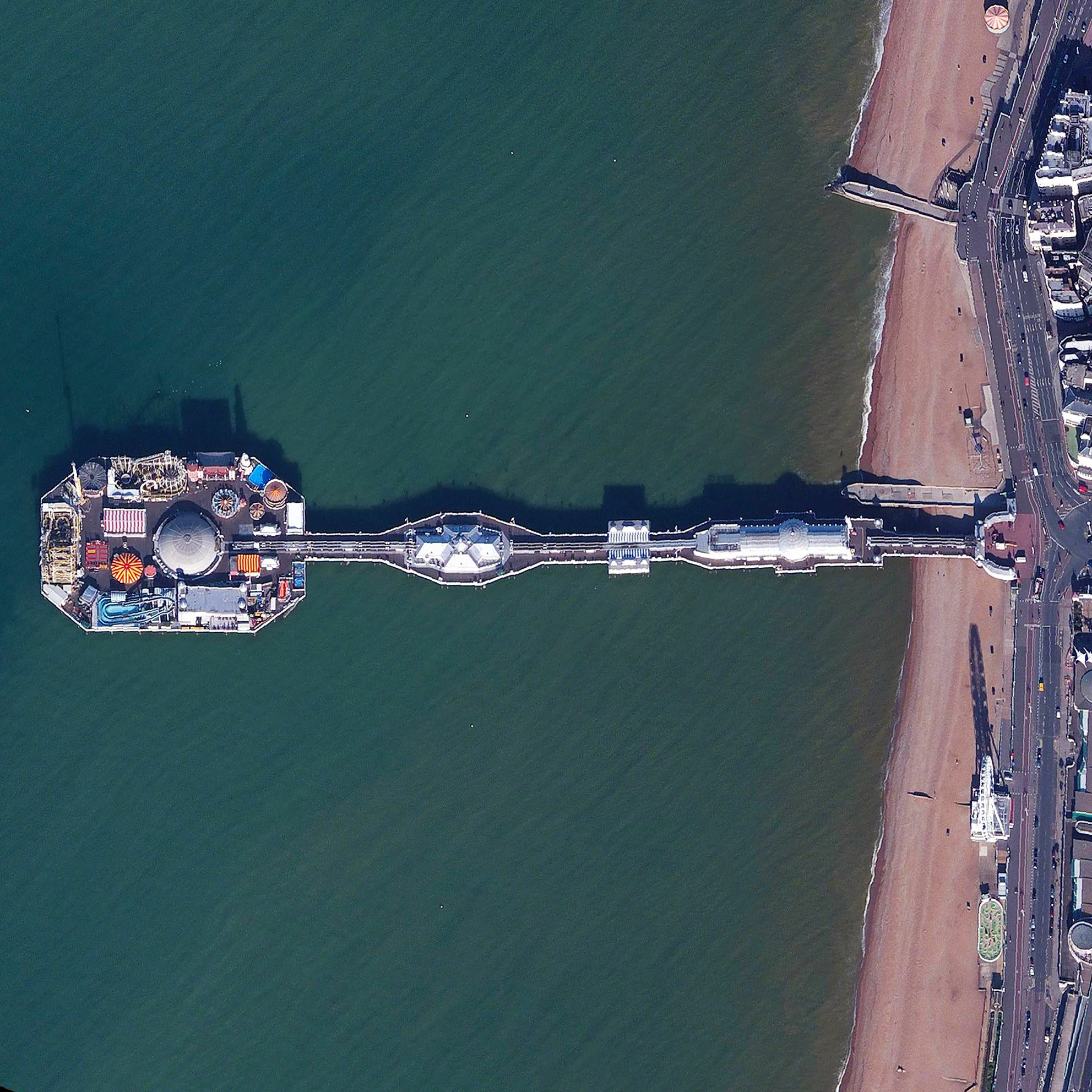 9/26/2015 Brighton Pier Brighton, England 50.816387979°, -0.137252700° Brighton Pier, also known as Palace Pier, is constructed off the coast of the English city of Brighton. Extending 1,719 feet (524 meters) into the English Channel, the structure contains numerous restaurants, rides, and roller coasters.