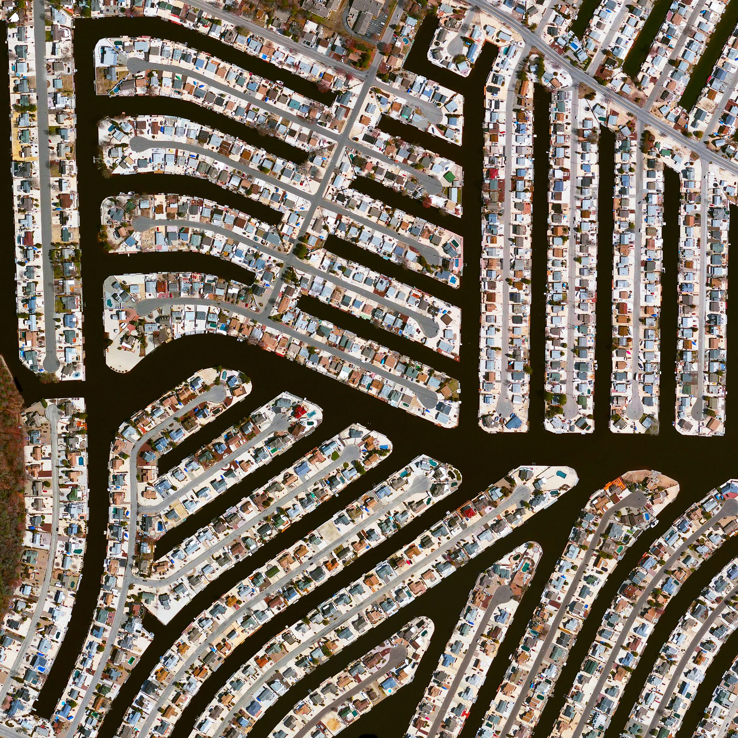10/14/2015 Residential houses Manahawkin, New Jersey, USA 39.671867711°, -74.238279907° Residential houses are built along canals in Manahawkin, New Jersey, USA. The town’s name is believed to have come from a Lenape word meaning "fertile land sloping into the water.” 