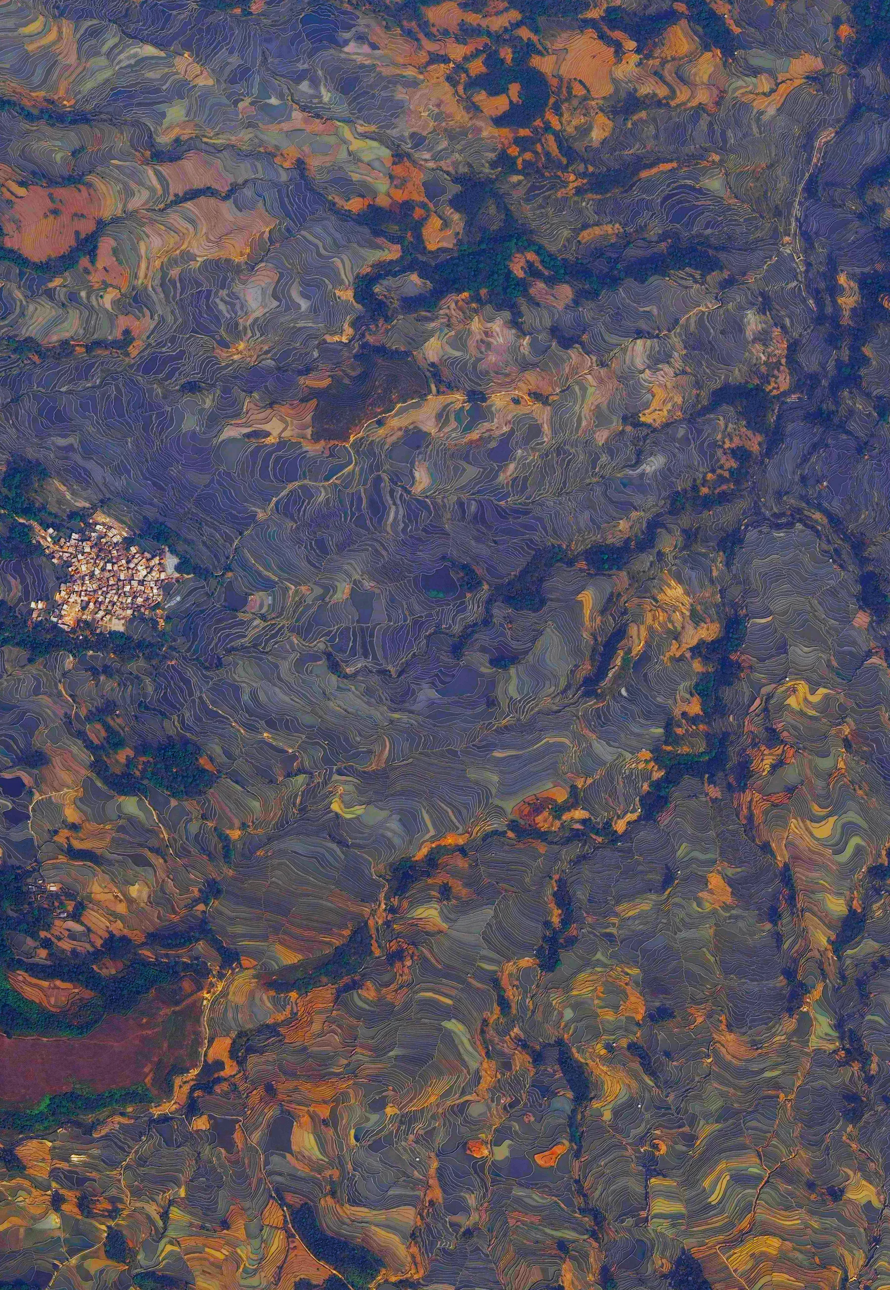 10/26/2015 Rice paddies Yuanyang County, China 23.126262141°, 102.751508762° Spectacular, terraced rice paddies cover the mountainsides of Yuanyang County, China. Cultivated by the Hani people for the last 1300 years, the slope of the terraces varies from 15 to 75 degrees with some having as many as 3,000 steps. Approximately 1.5 square miles of paddies are seen here surrounding the small village of Tuguozhai.
