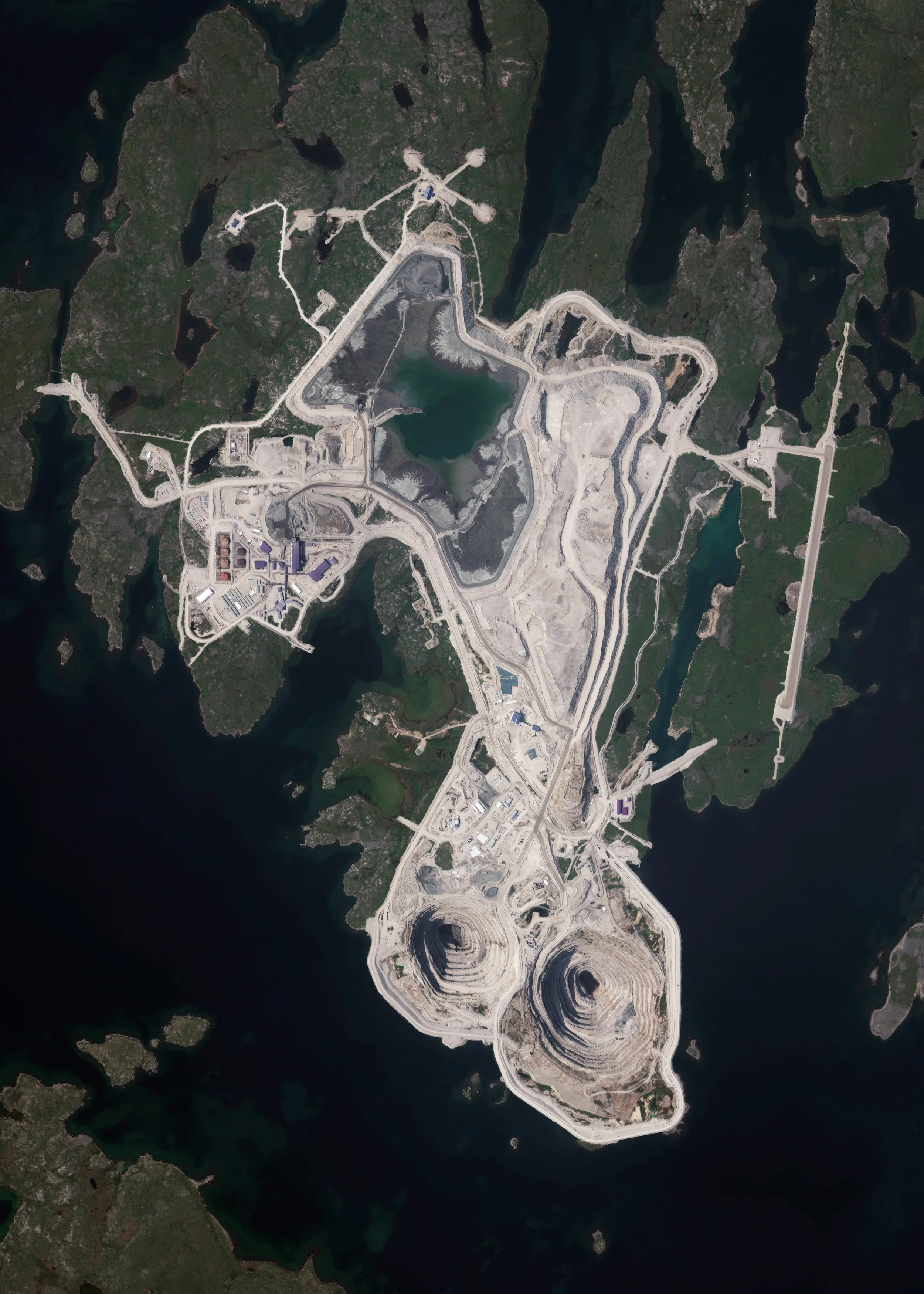 11/18/2015 Diavik Diamond Mine Northwest Territories, Canada 64.496111100°, -110.273333300° The Diavik Diamond Mine is located on the Lac de Gras lake in the Northwest Territories of Canada, 120 miles (193km) south of the Arctic Circle. The mine produces approximately 7.5 million carats of diamonds each year. In standard weight, that’s an annual output of 1500 kilograms or 3,300 pounds. In this Overview, the most distinguishable areas of the facility are its two primary open pits, waste ponds, processing facilities, and an airstrip capable of landing aircraft as large as 737s and C-130s.