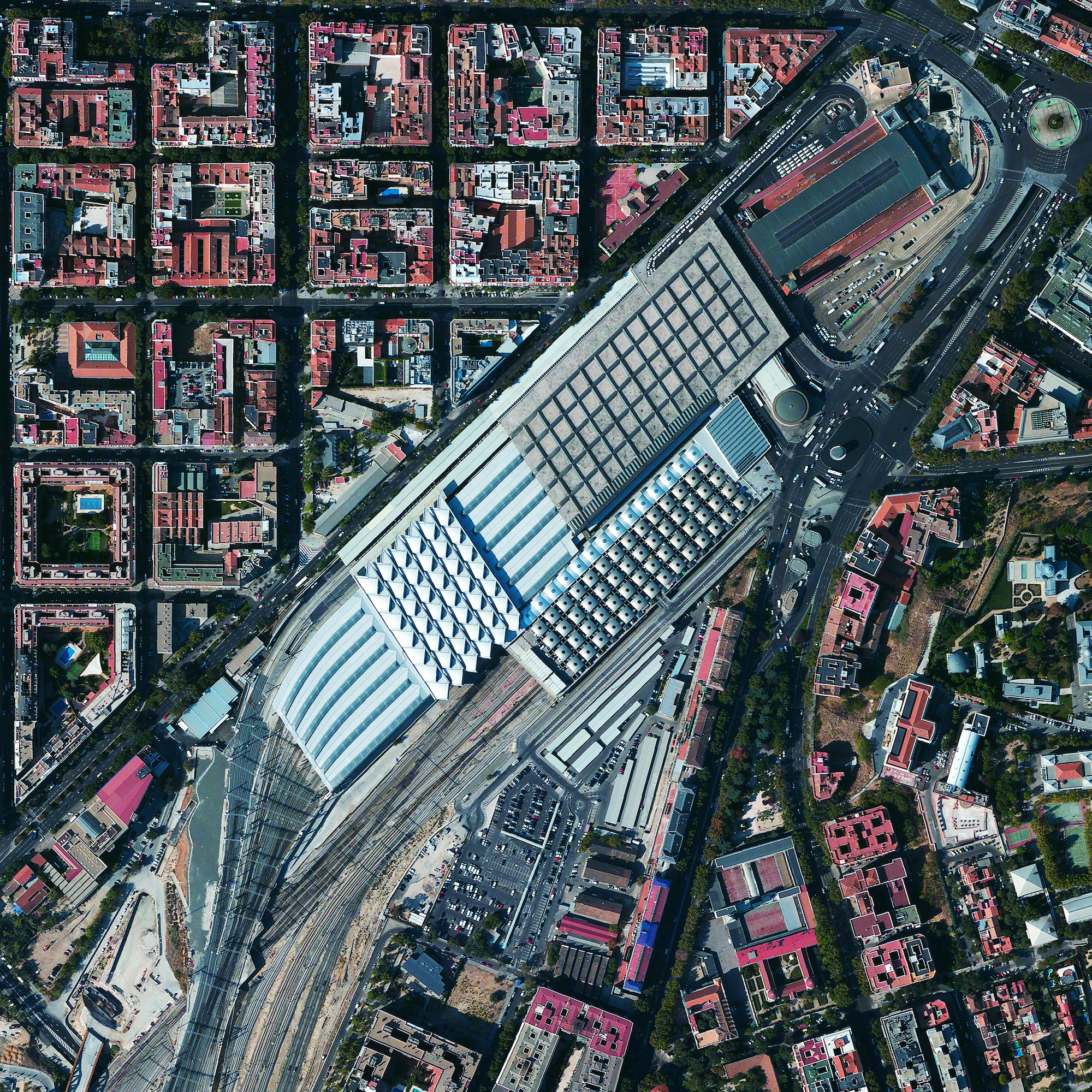 12/16/2015 Madrid Atocha Railway Station Madrid, Spain 40°24′24″N 3°41′22″W The Atocha Railway Station is the largest train station in Madrid, Spain. The facility serves as a hub for commuter trains, intercity and regional trains from the south, and AVE high-speed trains. In 1992, the station’s original terminal building was converted into a concourse with shops, a nightclub, and a 43,055 square foot tropical botanical garden.
