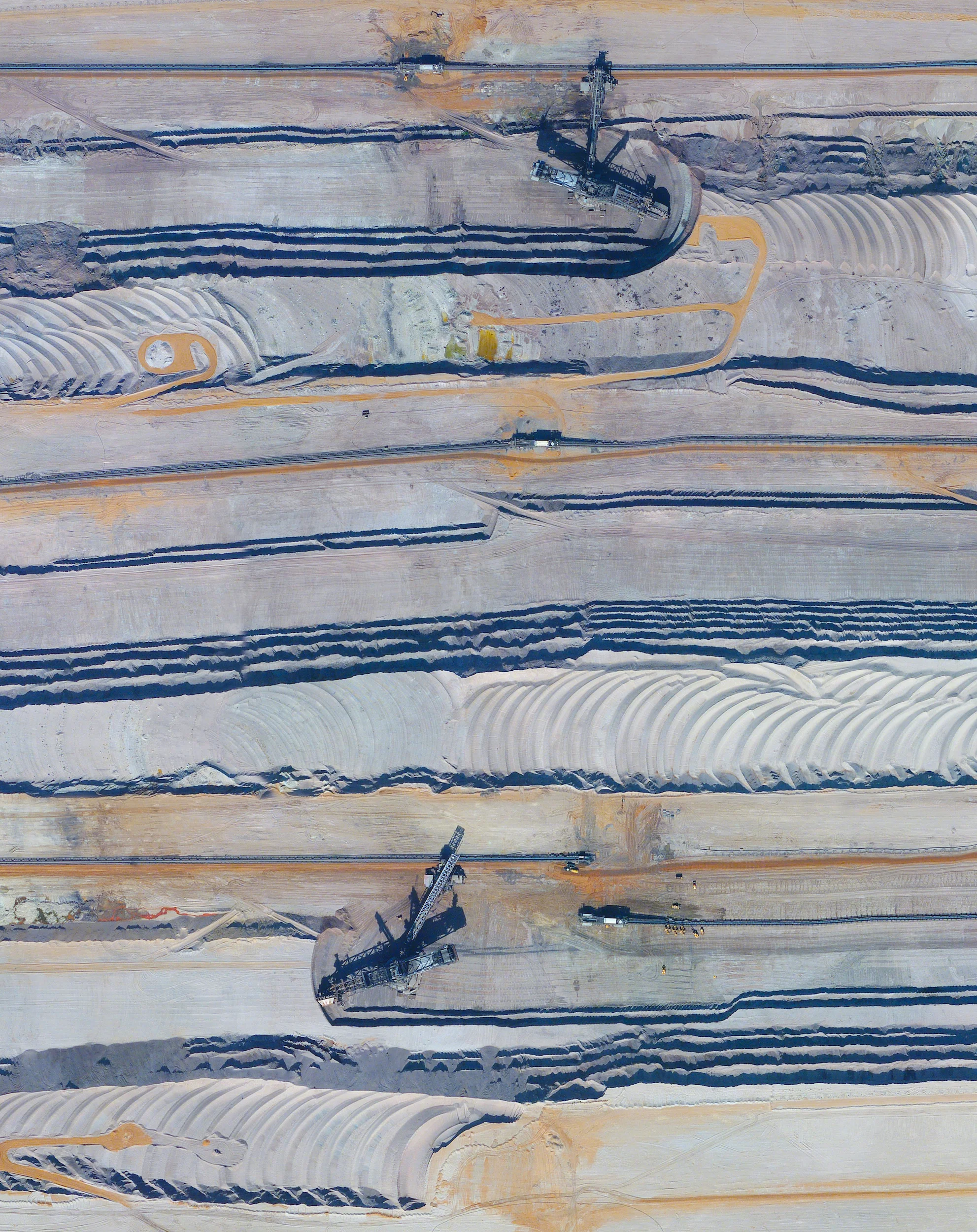 1/31/2015 Bucket-wheel excavators at Tagebau Hambach Elsdorf / Niederzier, Germany 50°54′39″N 6°30′10″E Bucket-wheel excavators run on tracks at the Tagebau Hambach open-pit mine in Niederzier and Elsdorf, Germany. These massive machines (up to 315 feet tall and 730 feet long) continuously scoop materials from the surface in order to extract lignite. Lignite, often referred to as “brown coal”, is a soft combustible sedimentary rock that is formed from naturally compressed peat and is used as a fuel for steam-electric power generation.