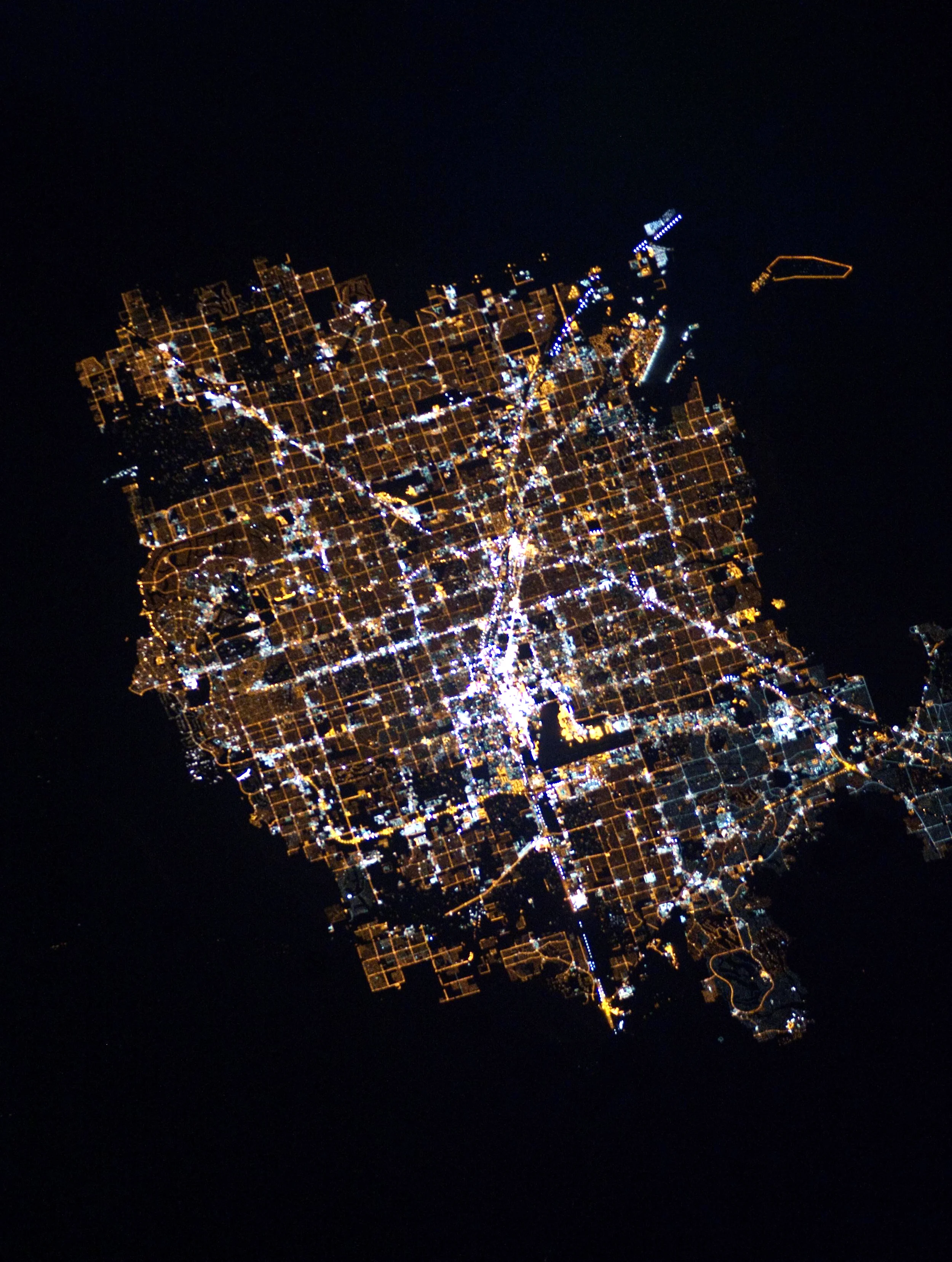 2/3/2016 Las Vegas at night Las Vegas, Nevada, USA 36°10′30″N 115°08′11″W The glowing lights of Las Vegas, Nevada are captured here from the International Space Station. Since the city is entirely surrounded by desert, its brightly lit grid of streets starkly contrasts the dark, undeveloped area on its outskirts. You’ll also notice the Las Vegas Strip - the city’s central avenue that is seen at the middle of this Overview. This particular area is one of the brightest spots on Earth due to the concentration of lights emanating from the hotels and casinos along the road. Source imagery courtesy of NASA