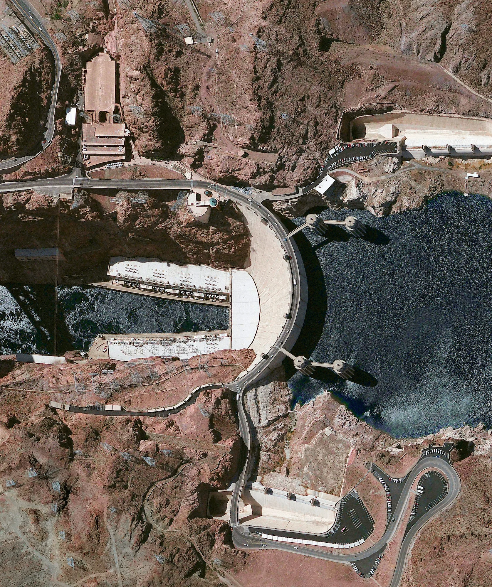 2/16/2016 Hoover Dam Nevada / Arizona, USA 36°0′56″N 114°44′16″W Hoover Dam is a 726-foot high, 1,244-foot wide concrete arch-gravity dam located on the Colorado River at the border of Arizona and Nevada. Constructed between 1931 and 1936 during the Great Depression, a workforce of approximately 20,000 poured a total of 4.36 million cubic yards of concrete to complete the structure. That is enough concrete to pave a two-lane highway from San Francisco to New York City.