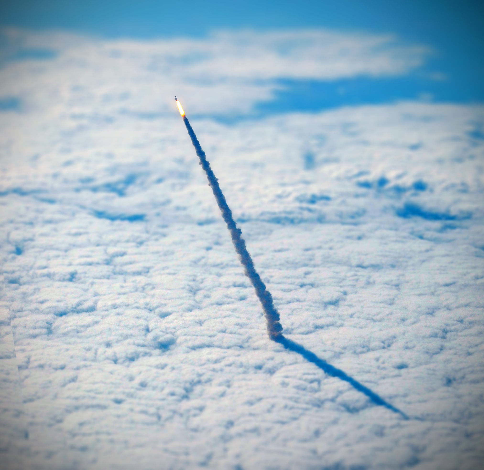 For your daily dose of perspective, here is a photograph of the space shuttle Endeavour, lifting through the clouds during its final launch in May 2011. The photograph was captured from a nearby NASA shuttle training aircraft. Source imagery: NASA