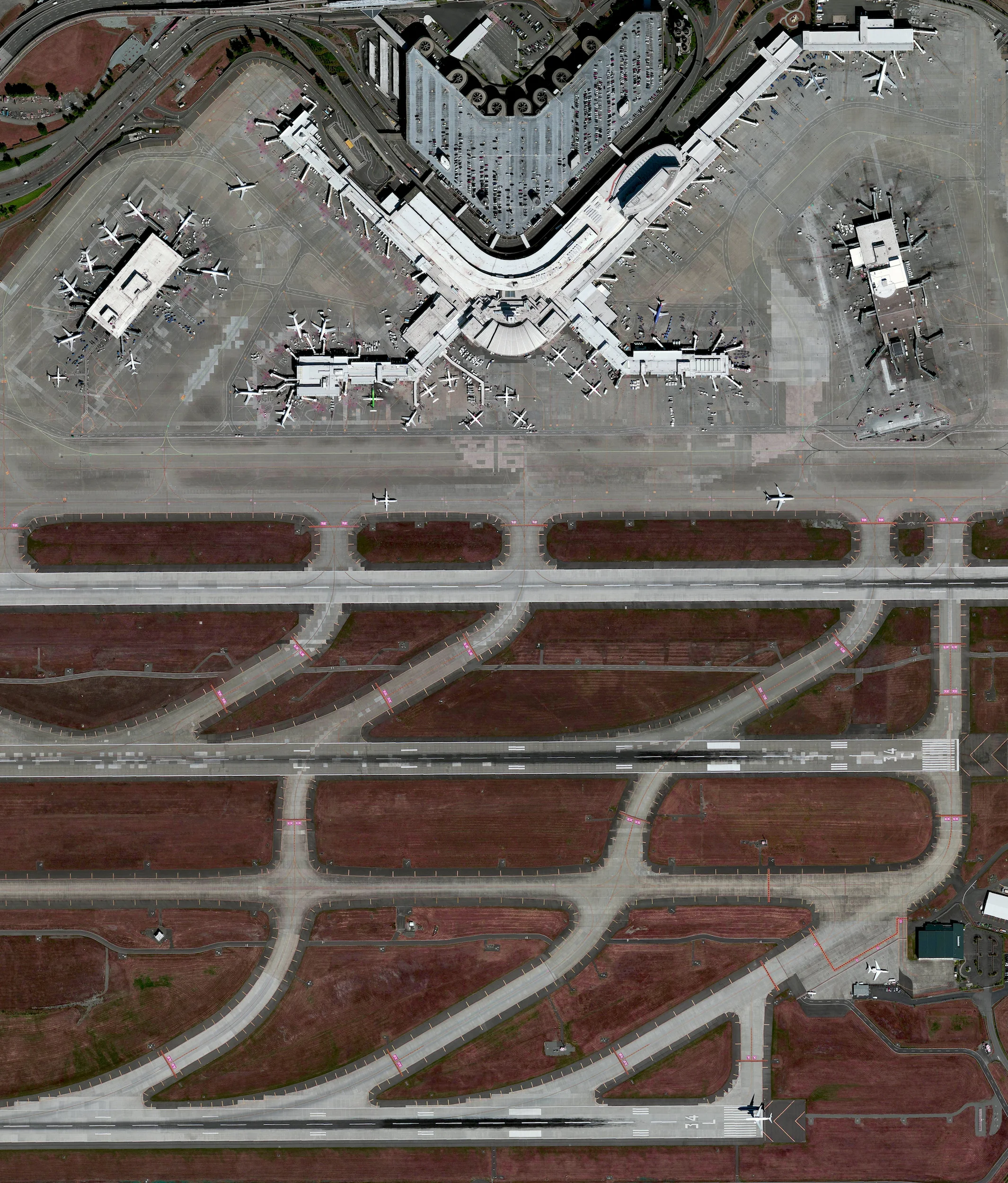 7/22/2016 Seattle-Tacoma International Airport Seattle, Washington, USA 47°26′56″N 122°18′34″W I’ll be heading to Seattle, Washington this morning for the State of the Map Conference! My flight to Seattle-Tacoma International Airport will be one of the roughly 380,000 aircraft movements that take place at the facility each year and I will be one of roughly 42 millions passengers that travel through the airport annually. The facility also contains a 13,000-car parking garage, the largest structure of its kind in North America, which is visible at the top of this Overview.