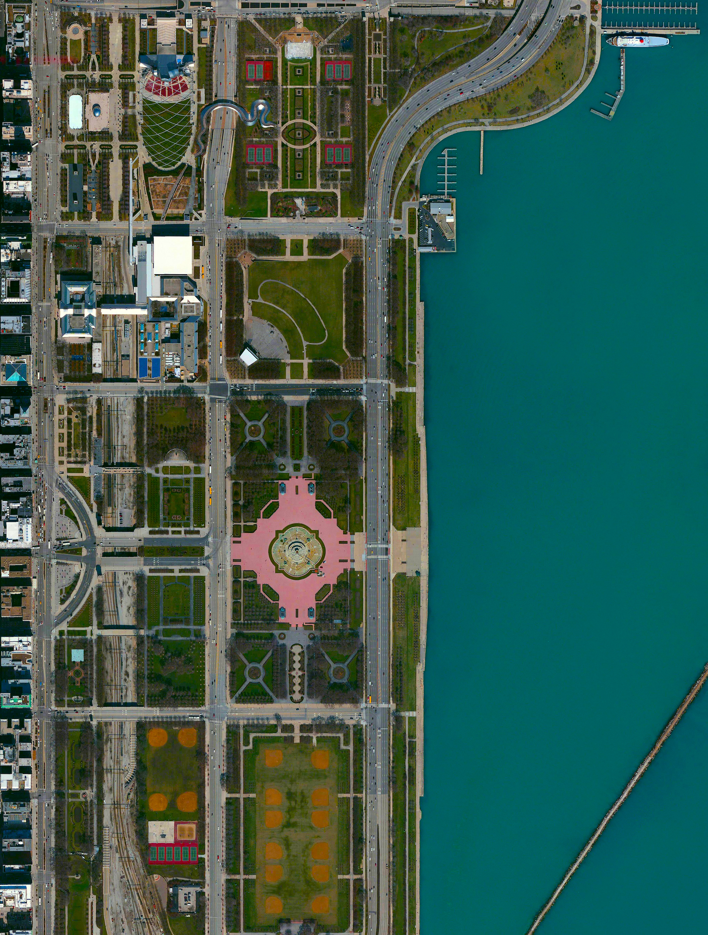 7/29/2016 Maggie Daley Park Chicago, Illinois, USA 41°52′57″N 87°37′08″W Today we’re thrilled to do our first post from our Neighborhood Portrait series with DNAinfo Chicago ! This Overview shows Maggie Daley Park in Chicago, Illinois, USA. To read the full story, click here . The park’s Buckingham Fountain stands out in this Overview with its ornate design and serve as a gathering point for thousands of visitors at the Lollapalooza festival this weekend. We’re excited to launch this series with DNAinfo, bringing together a collection of images celebrating the uniqueness and beauty of neighborhoods in New York and Chicago.