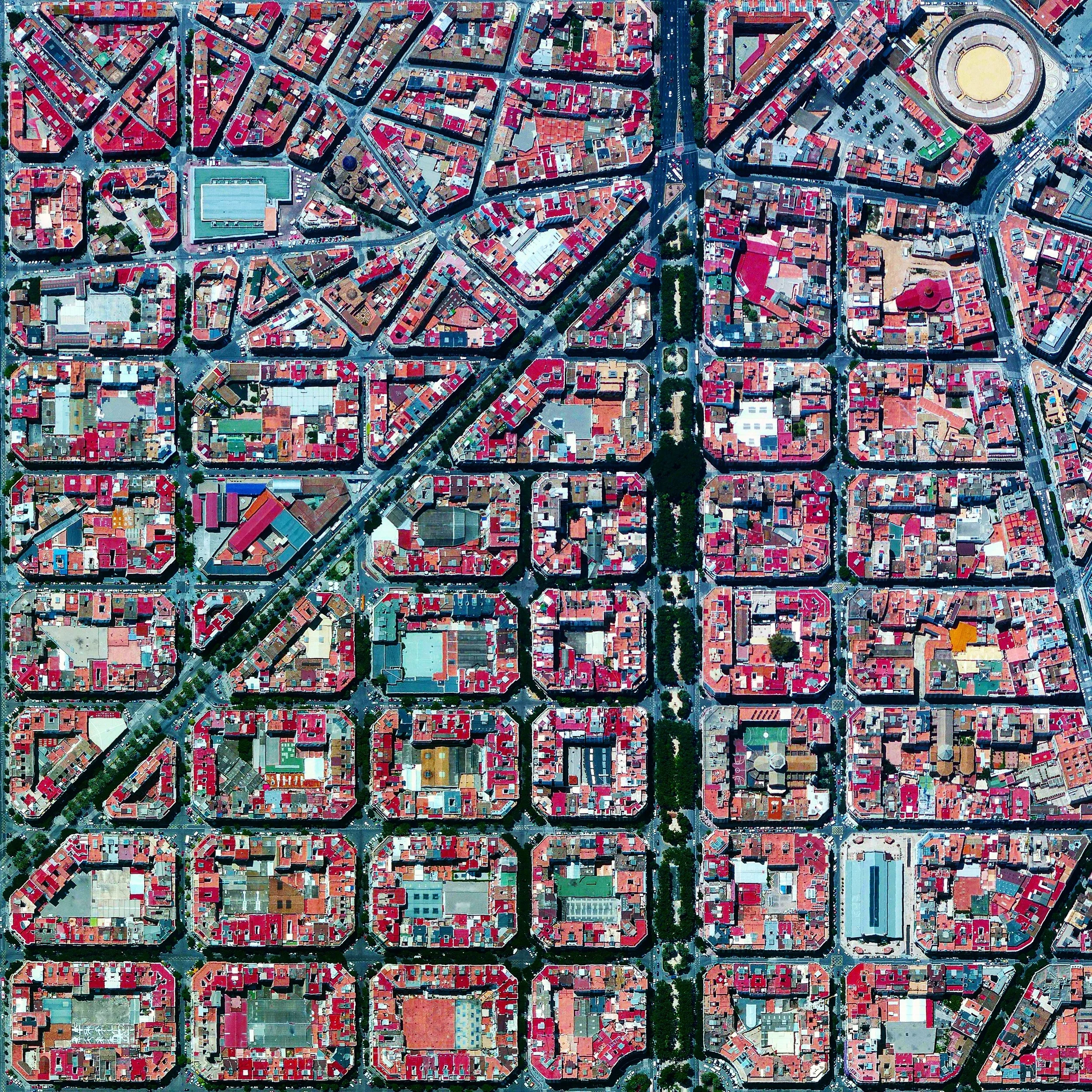 8/17/2015 L'Eixample Valencia, Spain 39°27′53″N 0°22′12″W The urban plan of the L’Eixample district in Valencia, Spain is characterized by long straight streets, a strict grid pattern crossed by wide avenues, and apartments with communal courtyards. A similar layout was used for the district of the same name in Barcelona. The circular structure in the upper right is the Plaza de Toros de Valencia - the city’s largest bullfighting arena.