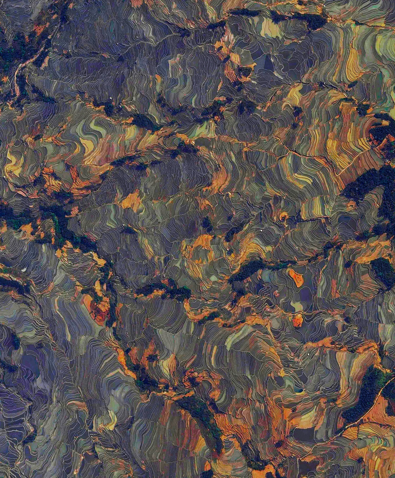 10/4/2016 Yuanyang Rice Terraces Yuanyang County, China 23°09′32″N 102°44′41″E Rice paddies, constructed in steps, cover the mountainsides of Yuanyang County, China. Cultivated by the Hani people for the last 1300 years, the slope of the terraces varies from 15 to 75 degrees with some having as many as 3,000 steps. As we’ve been getting a lot of questions recently about prints, I want to mention that this Overview, and many others, can be purchased directly from our website in the Printshop section!