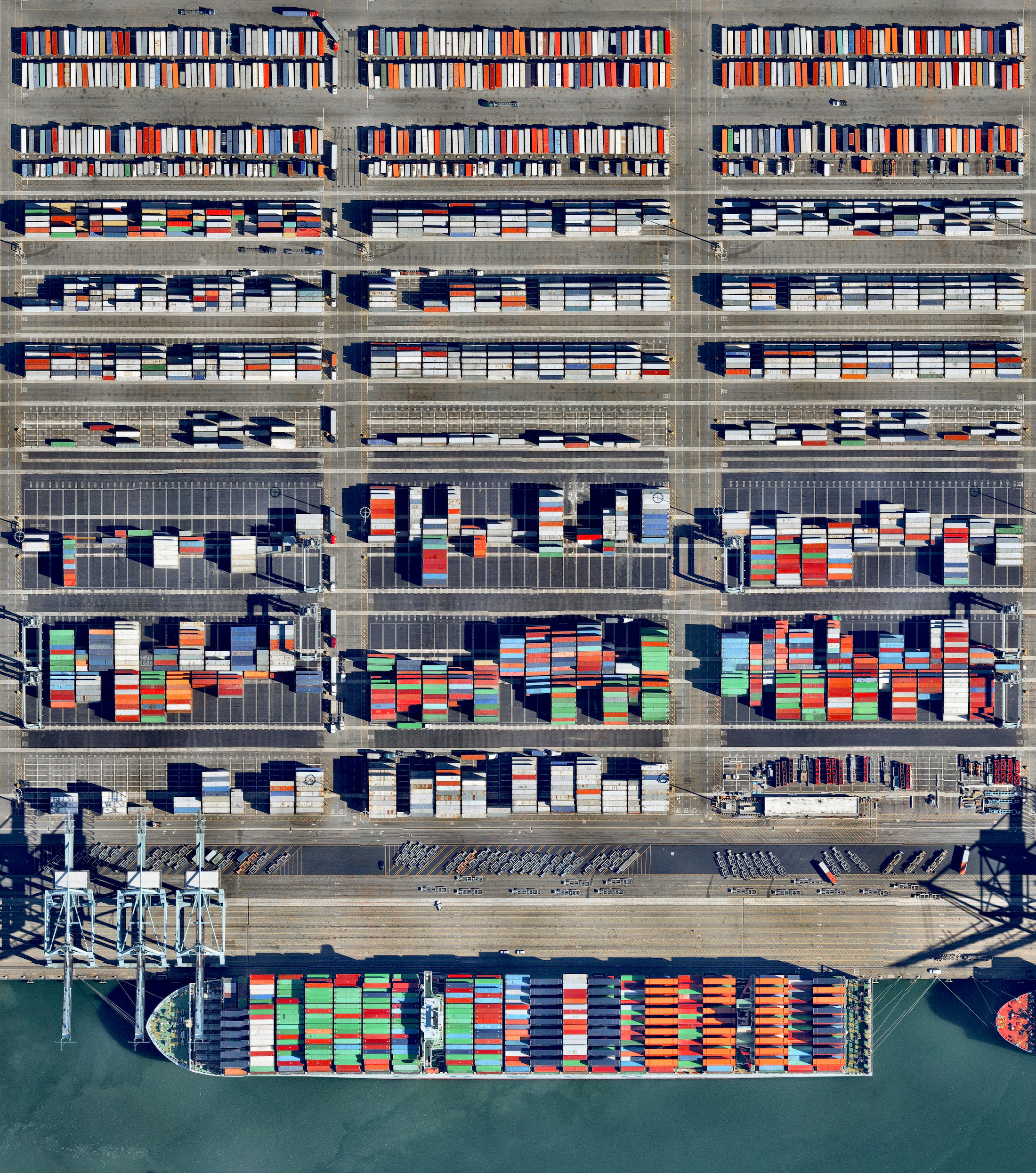 12/5/2016 Port of Long Beach Long Beach, California 33.754185°N 118.216458°W Shipping containers are loaded into a massive cargo ship (1200+ feet) at the Port of Long Beach — the second-busiest container port in the United States. The seaport generates approximately $100 billion in trade, employs more than 316,000 people, and along with the Port of Los Angeles to which it is connected, serves as the single largest source of air pollution in the metropolitan LA area. Source imagery: Nearmap