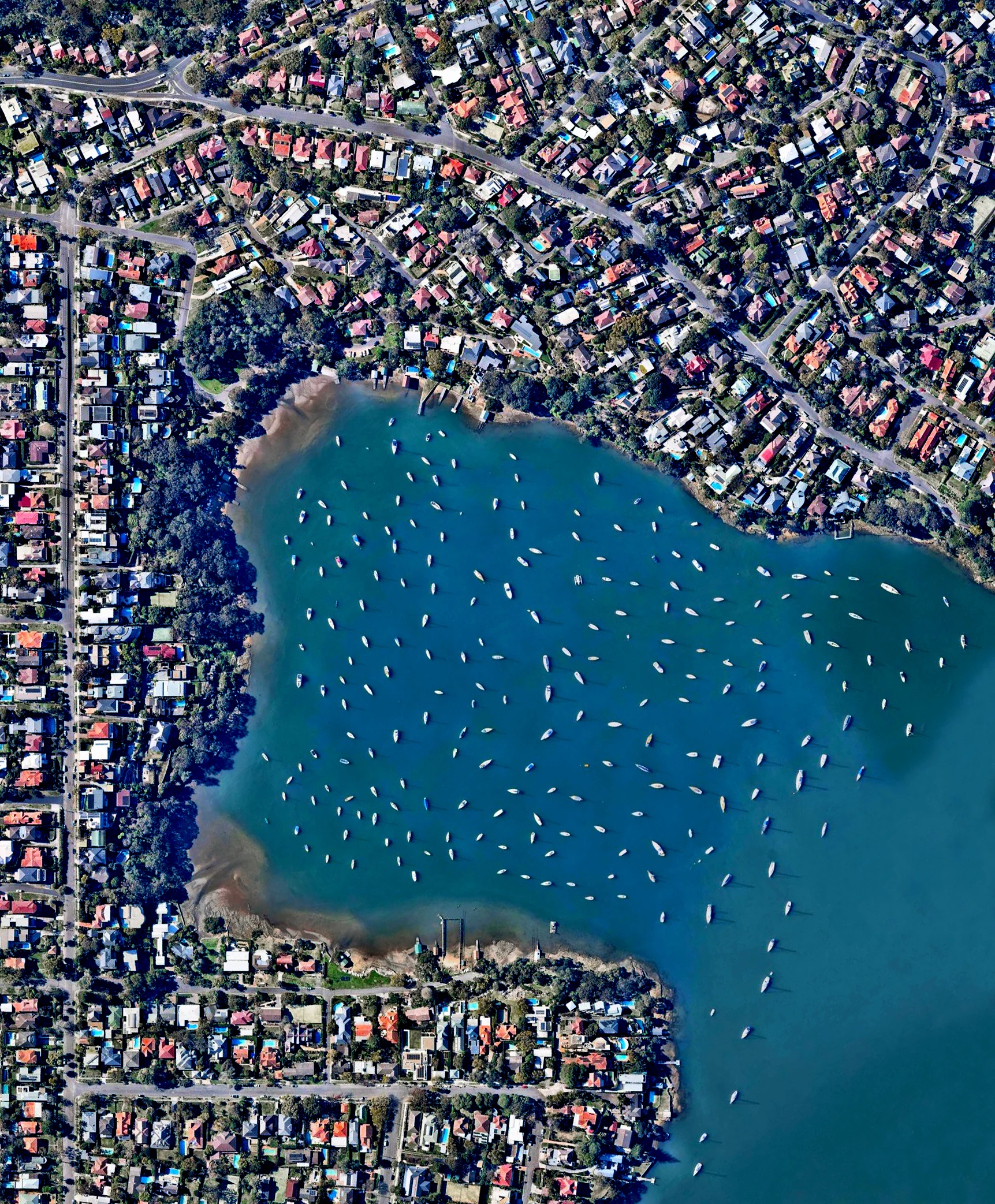 3/17/2017 Woodford Bay New South Wales, Australia -33.8298731,151.1739571 Sailboats are moored in Woodford Bay, New South Wales, Australia. Thousands of boats like the ones seen here are stationed in the channels and around the islands in the greater Sydney area. Wherever you are in the world, we hope you have a peaceful, fantastic weekend!