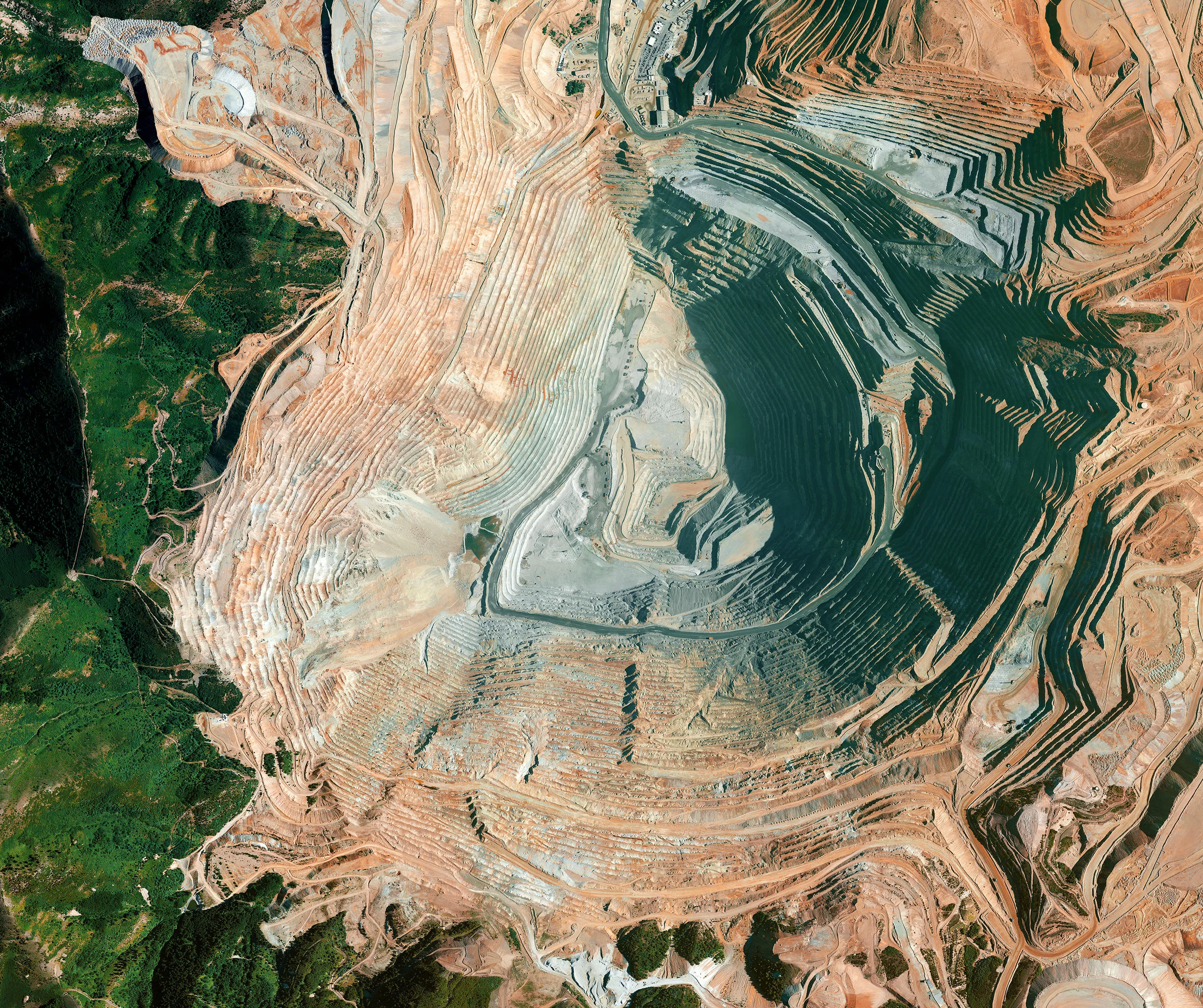 4/4/2017 Bingham Canyon Mine Salt Lake City, Utah 40.523000, -112.151000 The Bingham Canyon Mine is an open-pit mine in Salt Lake City, Utah. At 2.5 miles wide and 0.6 miles deep, it is the largest man made excavation in the world. On April 10th, 2013, a landslide took place at the pit that was the single largest non-volcanic landslide to ever happen in North America. The amount of debris that fell into the mine was roughly equivalent to 1/6 of the volume of all humans alive on Earth. Source imagery: DigitalGlobe