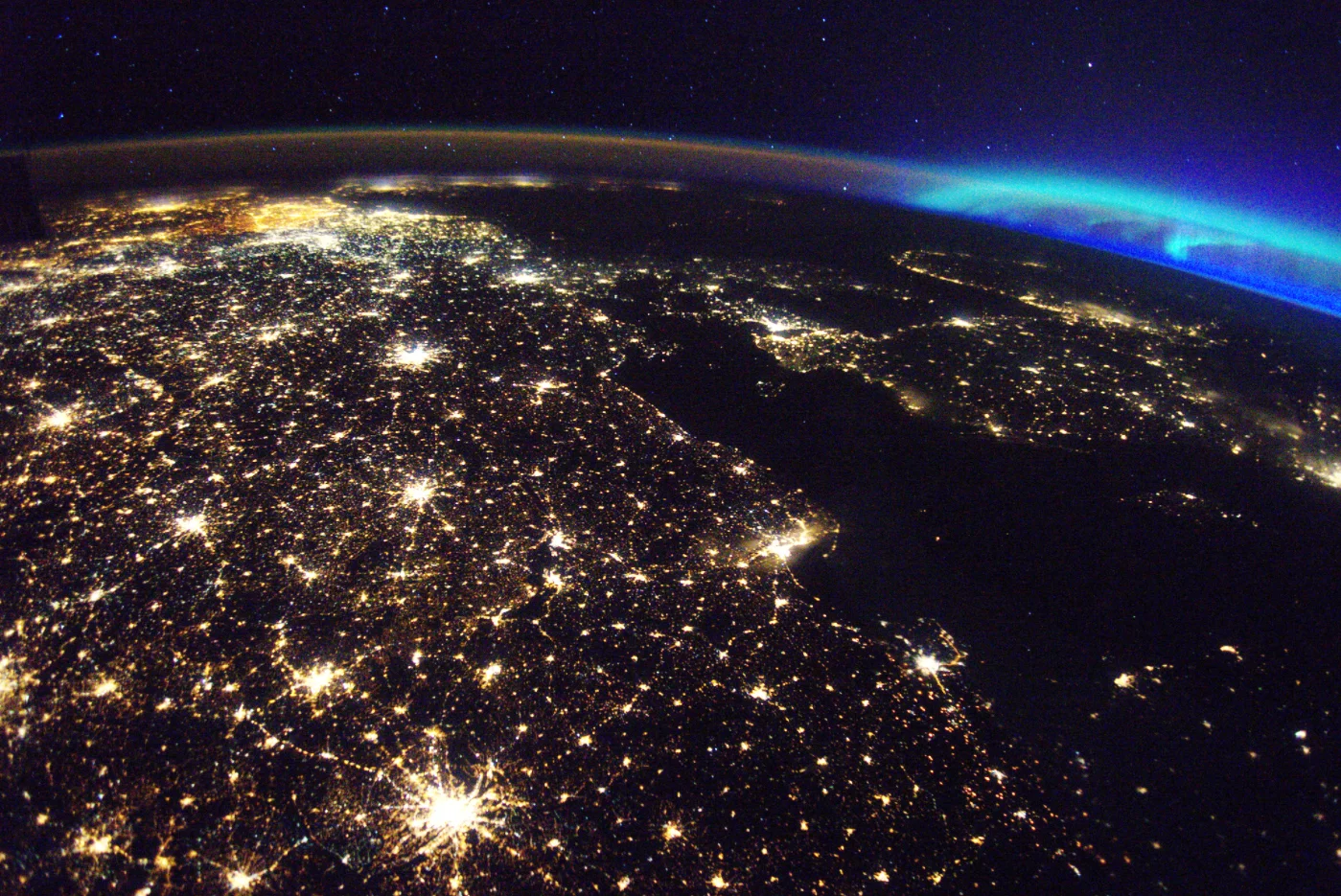 5/13/2017 Western Europe Europe Check out this stunning view of Western Europe with the the aurora borealis in the background from the International Space Station! This photo was taken 250 miles above our home planet by astronaut Thomas Pesquet. The major cities of Germany and Belgium are both illuminated in this shot. Photo taken by Thomas Pesquet