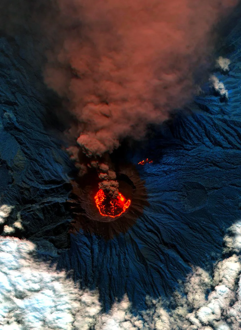 Lava and ash billow out of Raung, one of the most active volcanoes on the island of Java in Indonesia. Raung towers more than 10,000 feet above sea level and was captured here during a powerful eruption in 2015 with a short-wave infrared satellite camera. The ash produced during this activity forced the closure of numerous airports on the island. 8°07′30″S 114°02′30″E