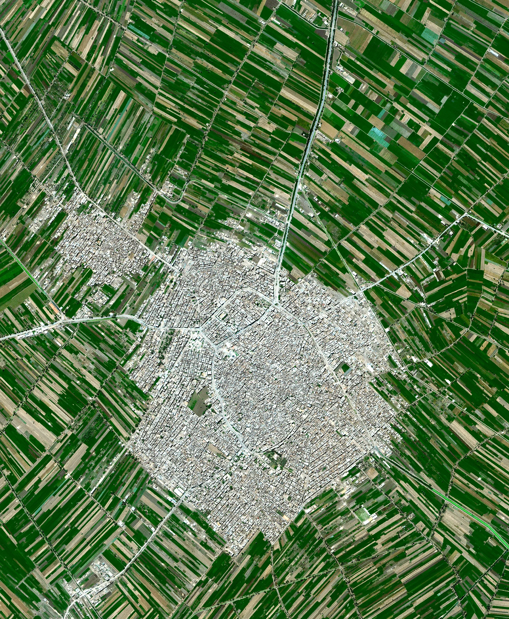 Agricultural development encircles the towns of Ausim and Shinbari in the Cairo Governorate of Egypt. The towns are located within the fertile area surrounding the Nile River, the country’s main source of water because it has no effective rainfall. The roughly 55 billion cubic meters of water that are used from the river each year represents more than three quarters of the country’s resources for usable water. 30.1229437, 31.1336762