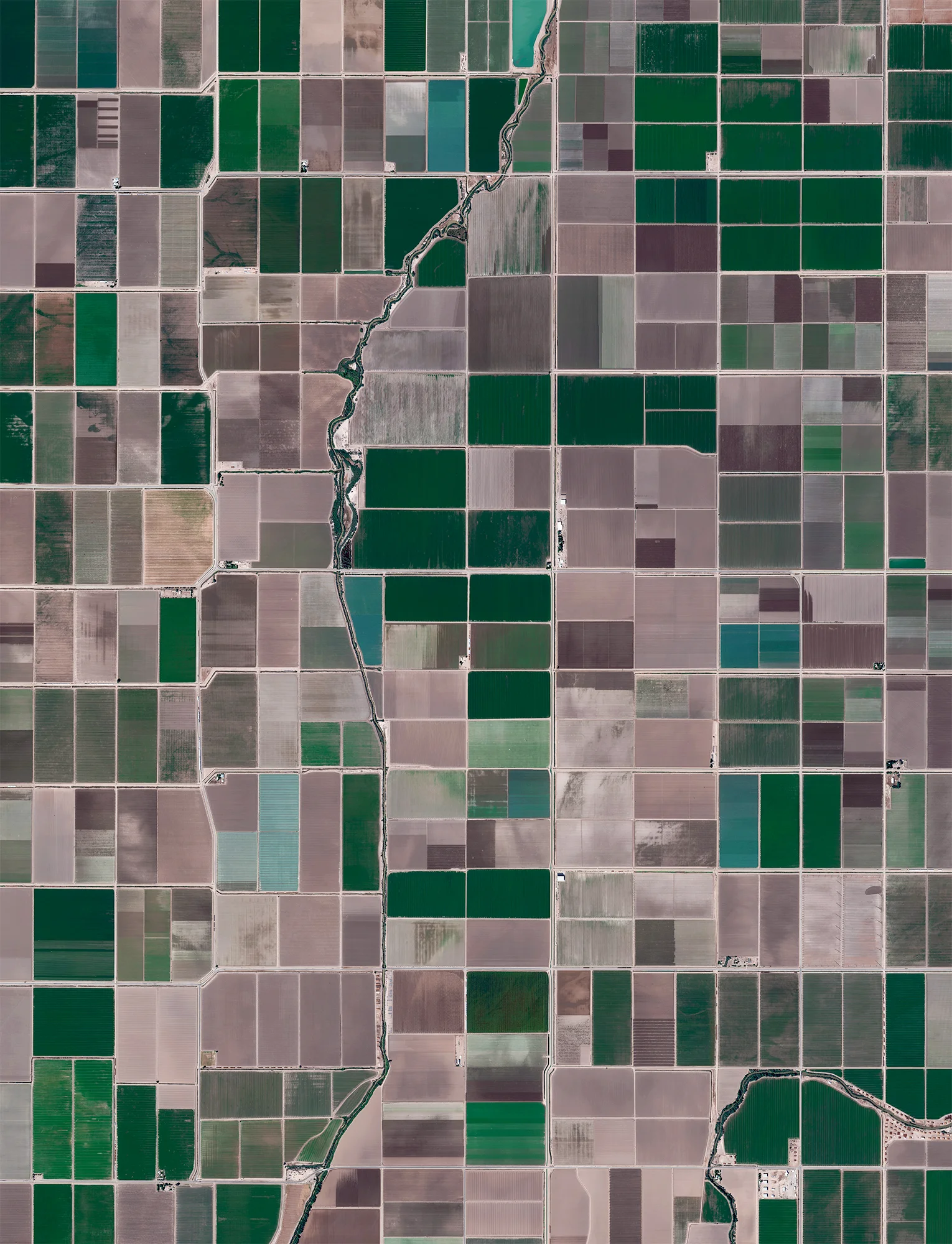 Agricultural development is seen in Calipatria, California, USA. At an elevation of 180 feet (55 m) below sea level, the city has the lowest elevation in the western hemisphere. 33.11641, -115.62727