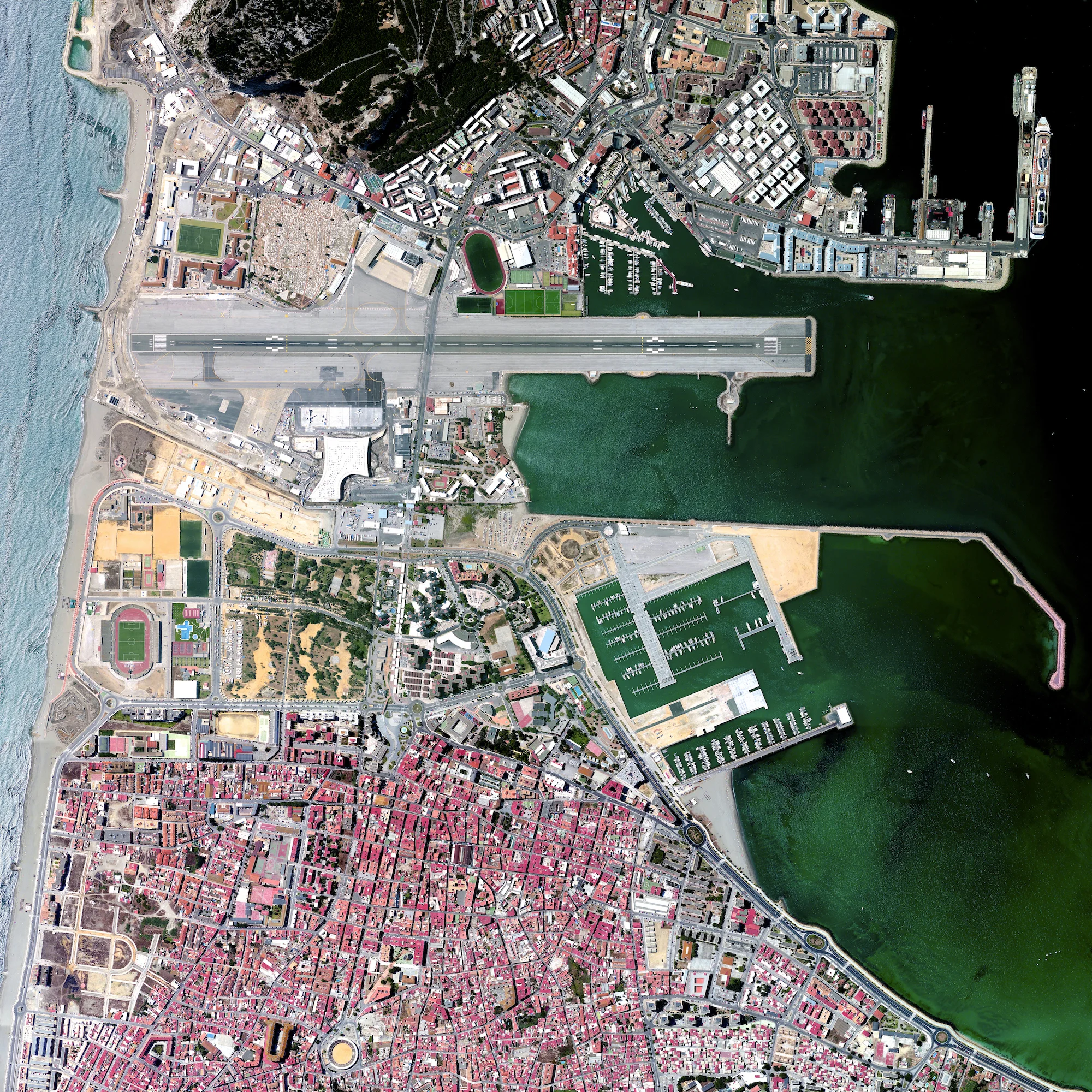 Gibraltar International Airport is the primary aviation facility for the British overseas territory of Gibraltar and the neighboring areas of Spain such as Costa de Sol. Winston Churchill Avenue, the main road heading towards the border with Spain, crosses over the airport runway. Consequently, the road has to be closed every time a plane is landing or taking off. 36.1519821, -5.3467926