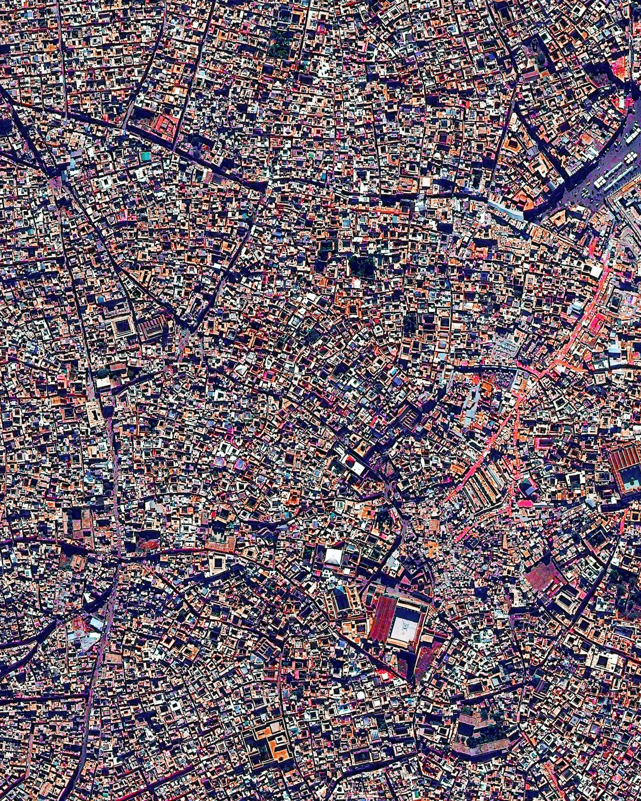 The medina quarter in Marrakesh, Morocco is characterized by its winding, maze-like streets. Because the intricately connected honeycomb of alleyways narrows to less than a meter wide (~ 3 feet) at certain spots, the area is generally free from car traffic. 31.633080°, -7.986173°