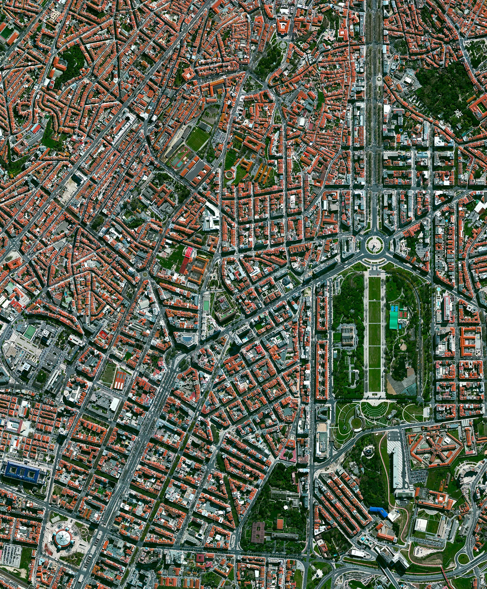 Lisbon is the capital and the largest city in Portugal with an estimated population of 552,700. This Overview captures a sizable portion of the downtown area, including the green space at right called Parque Eduardo VII — a massive city park known for its exotic plants, monuments, and panoramic views of the city. Lisbon is the only capital in Europe located on the Atlantic Ocean. 38°43′42″N 9°9′10″W