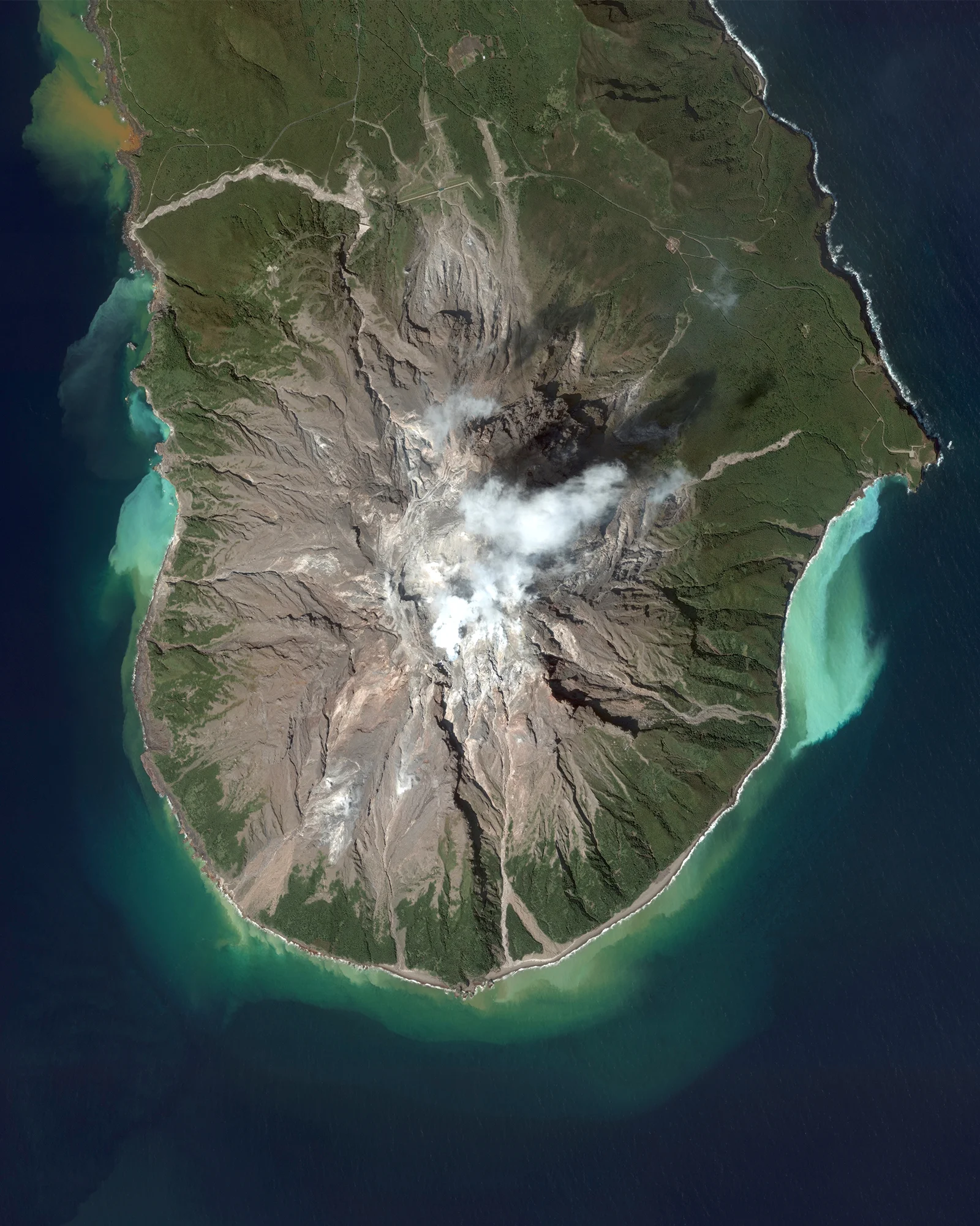 Iōjima is an island located 59 miles (110 km) south of Kagoshima, Japan. Iōjima experiences frequent volcanic activity, which results in massive amounts of sulfur dioxide flowing into the sea. This causes the surrounding waters to turn yellow, green, and teal as seen here. The island has a total area of 4.5 miles (11.65 sq km) and a population of 142 persons. 30.7908333, 130.2785963 Source imagery: DigitalGlobe