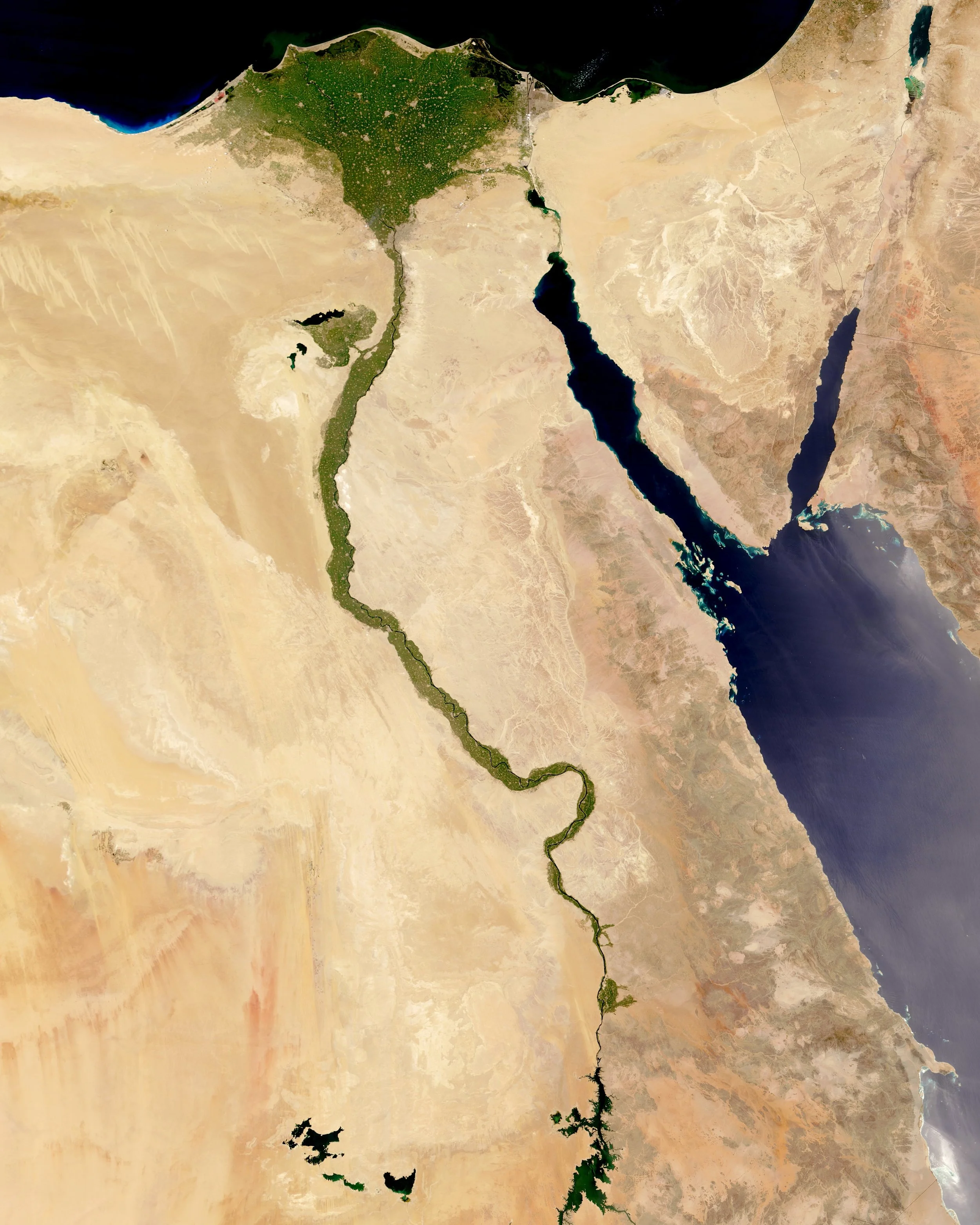 The Nile River is commonly regarded as the longest river in the world, flowing for 4,258 miles (6,853 km) over 11 countries in northeastern Africa. In this Overview, it is shown flowing north through Egypt, forming a large triangular delta before emptying into the Mediterranean Sea. Civilizations since ancient times have depended on the waters of the Nile to flood and fertilize surrounding desert lands. 29°20'11.0”N, 31°13'28.8"E Source imagery: NASA - National Aeronautics and Space Administration