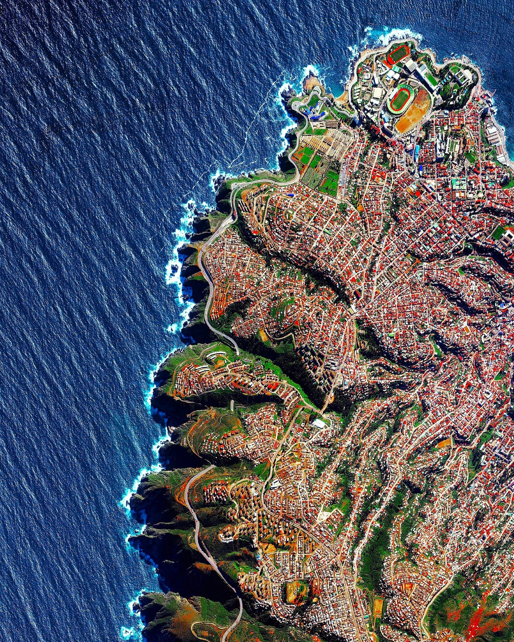 Valparaíso, Chile is built upon dozens of steep hillsides overlooking the Pacific Ocean. Known as “The Jewel of the Pacific,” the city is the sixth largest in the county and is home to approximately 285,000 residents. Valparaíso is also home to the country’s first public library, South America’s first volunteer fire department, and the world’s longest running Spanish language newspaper in continuous publication. 33°01'44.7"S, 71°38'46.9"W Source imagery: DigitalGlobe
