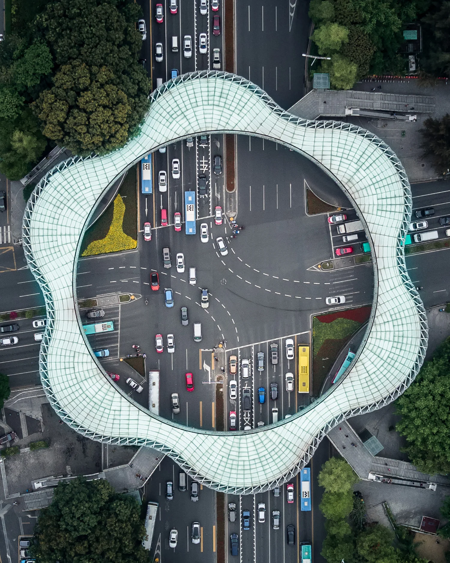 The Chunhua Footbridge circles the intersection of Shennan and Nanshan Avenues in Shenzhen, China. Built at a cost of 50 million yuan ($7.8 million), the footbridge is 14 meters wide, 130 meters long, and has 13 elevators. Its name, Chunhua, aptly translates to “spring flower” in English. 22°32'35.3"N, 113°55'08.6"E Source imagery: Jeryl Teo (@j9ryl)