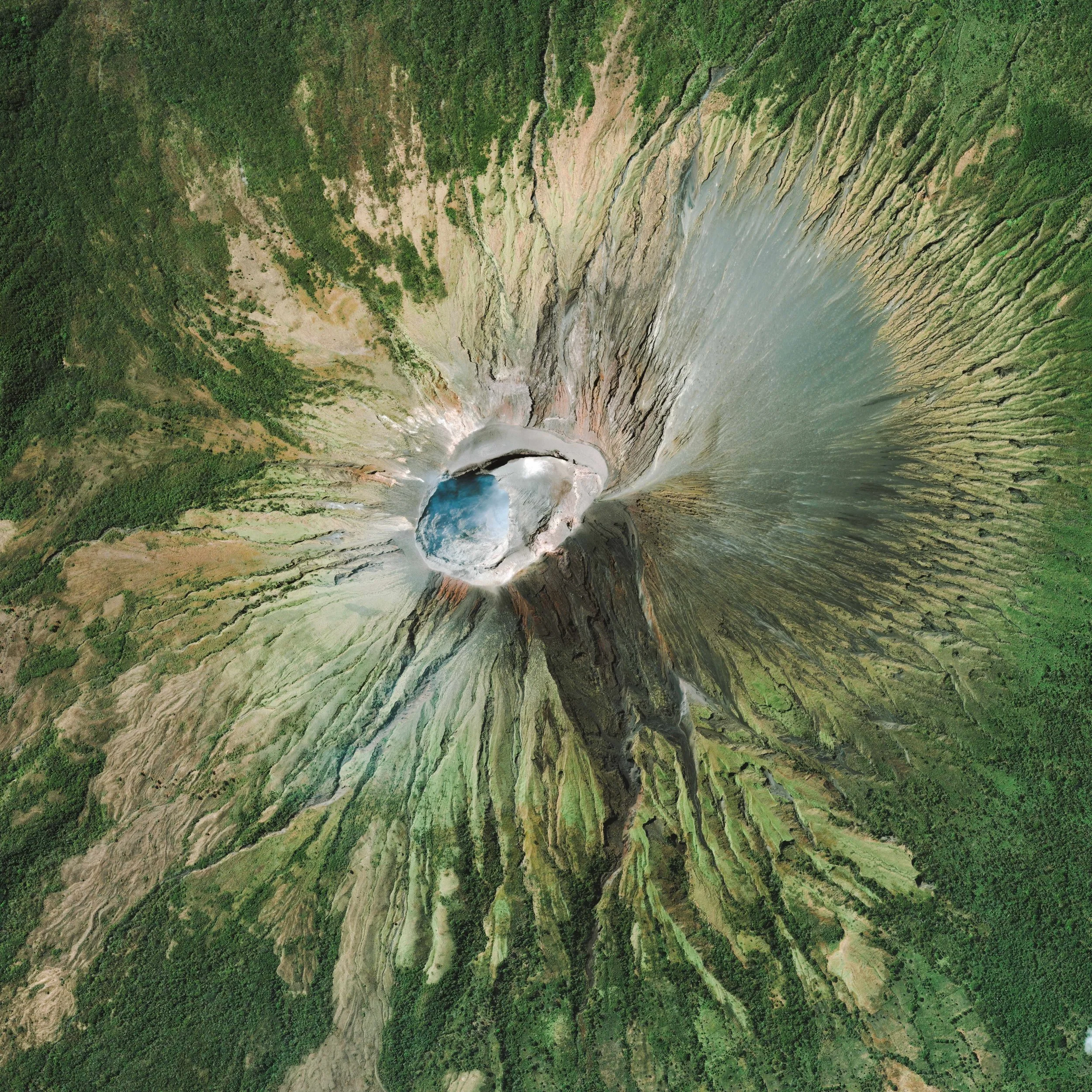 San Cristóbal Volcano is the highest and one of the most active volcanoes in Nicaragua. Standing at 5,725 feet (1,745 m), it is located in the northwest corner of the country near the city of Chinandega. San Cristóbal has been consistently active since 1997, including an eruption on Christmas Day in 2012 that caused hundreds of nearby residents to evacuate. 12°42'13.8"N, 87°00'02.8"W Source imagery: DigitalGlobe