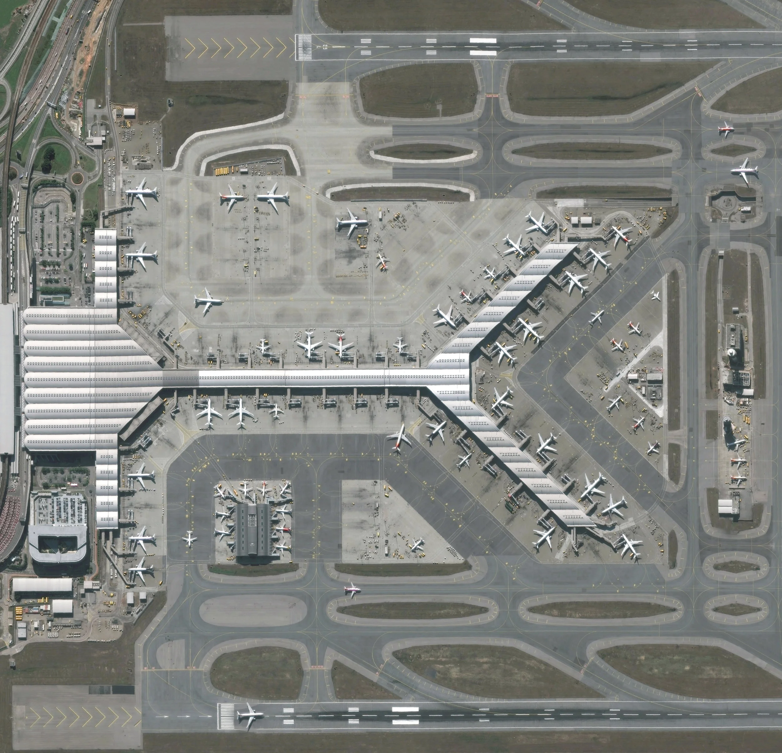 Hong Kong International Airport is located on Chek Lap Kok, an island in Hong Kong’s western waters. It is the world’s busiest cargo gateway and also one of the busiest passenger airports on Earth, handling upwards of 65 million passengers a year. Terminal 1, seen here, measures 570,000 square meters (6.1 million square feet), making it the third largest passenger terminal in the world. 22°18'48.8"N, 113°55'49.8"E Source imagery: DigitalGlobe