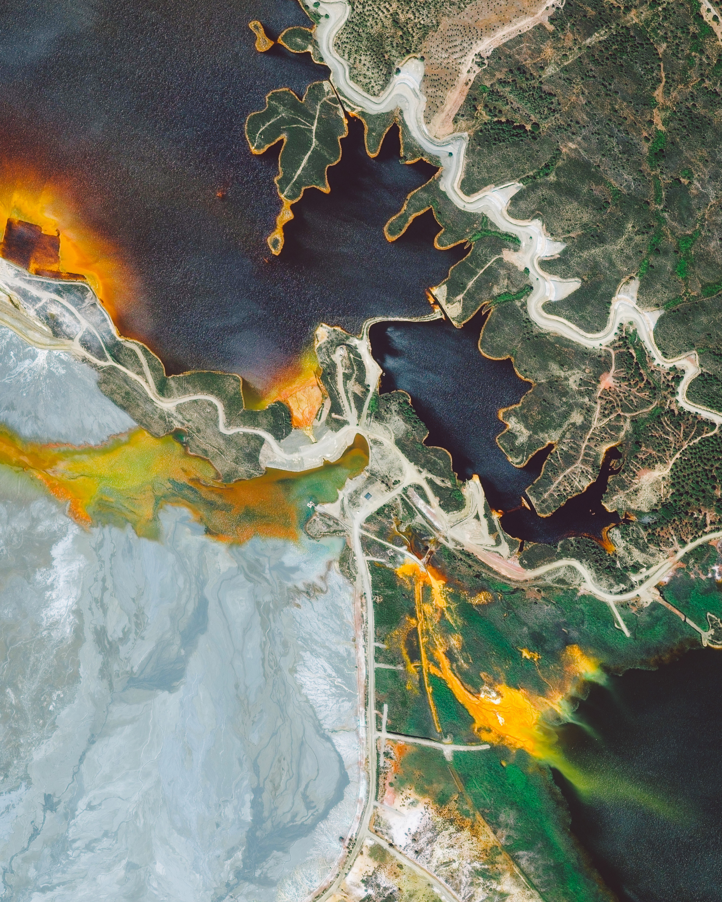 Since ancient times, the Rio Tinto Mines in Huelva Province, Spain, have been excavated for copper, silver, gold, and other minerals. They are named for the nearby Rio Tinto River, which — as a result of centuries of mining — is extremely acidic and has a distinct red-orange color. After being closed for more than a decade, the mines reopened in 2015 an remain operational today. 37°43'50.8"N, 6°36'02.4"W Source imagery: DigitalGlobe
