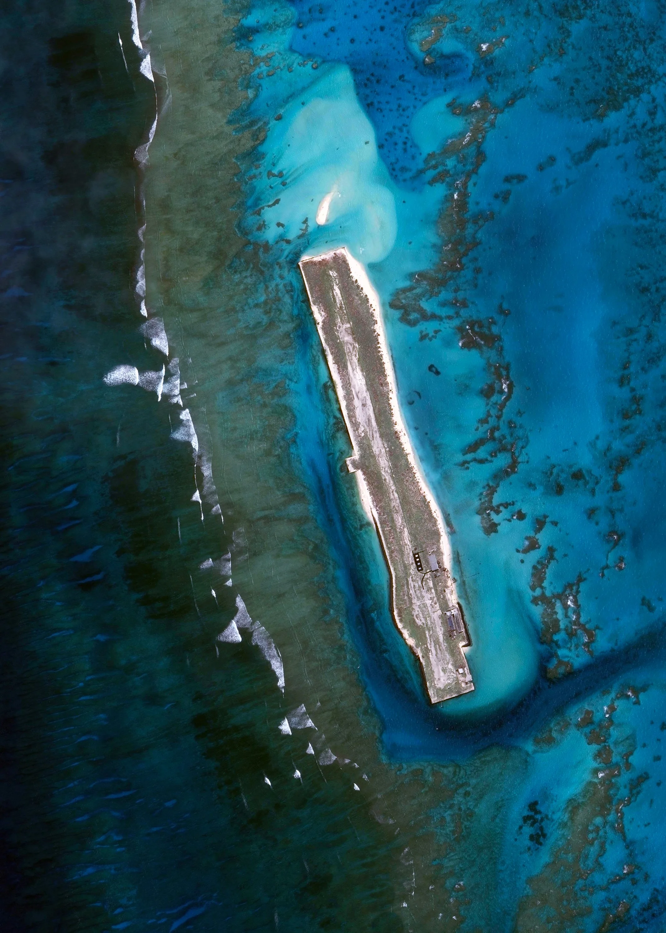 French Frigate Shoals Airport is a private airfield on Tern Island in French Frigate Shoals, Hawaii. Located roughly 560 miles northwest of Honolulu, the airport has a coral surface that is 3,000 feet long, 200 feet wide, and sits just six feet above sea level. It is owned by the U.S. Fish and Wildlife Service and is only used for emergencies. 23°52'12.5"N, 166°16'58.5"W Source imagery: DigitalGlobe