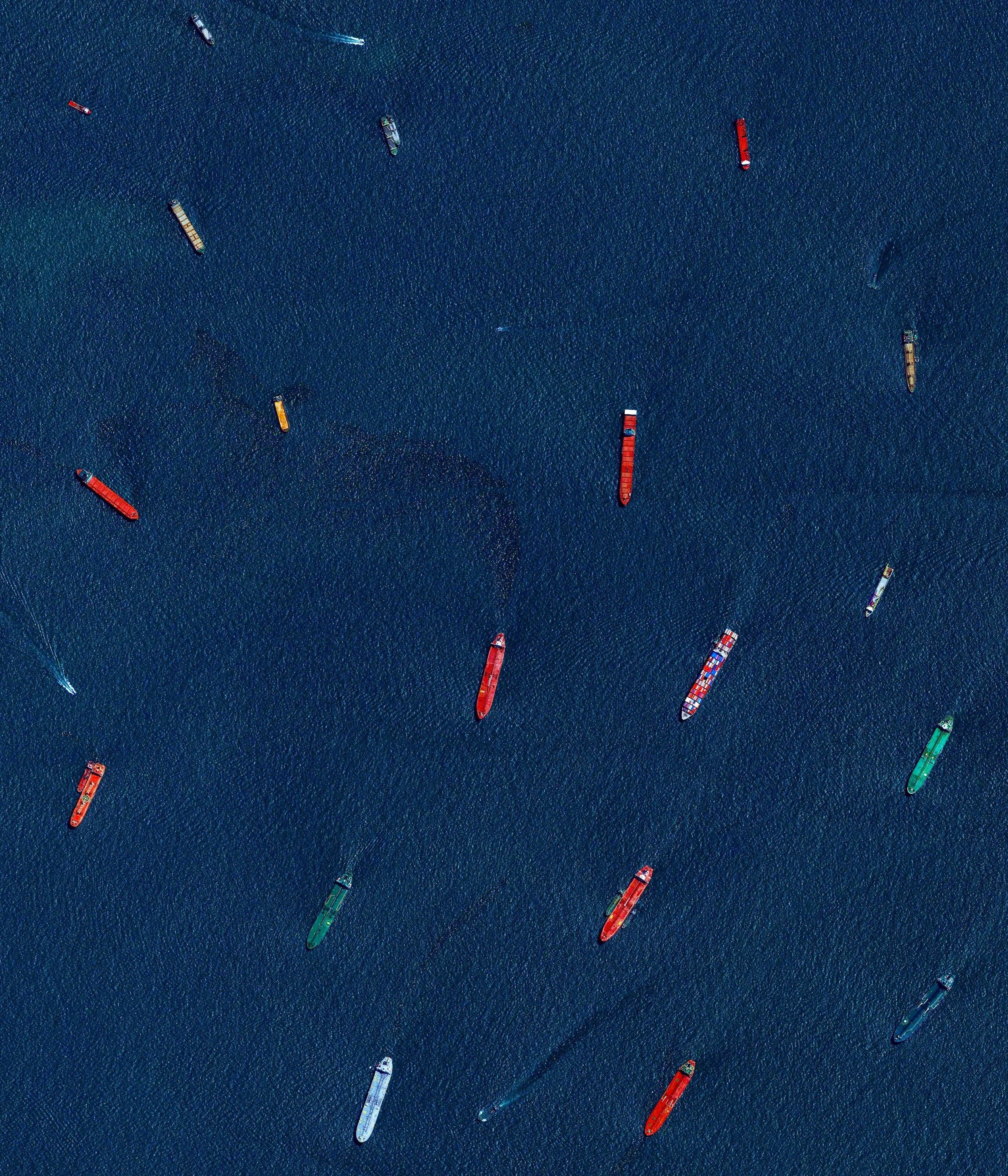 Check out this Overview, which captures cargo ships and tankers — some weighing up to 300,000 tons — outside of the entry to the Port of Singapore. The facility is the world's second-busiest port in terms of total tonnage, shipping a fifth of the world's cargo containers and half of the world's annual supply of crude oil. 1°15'21.4"N, 103°46'51.6"E Source imagery: DigitalGlobe