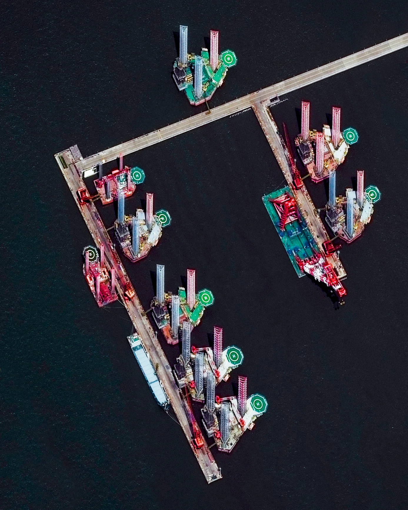 Several offshore oil rigs sit atop the waters of the Yangtze River Delta in eastern China. As of 2015, China is the second largest oil-consuming country in the world, behind the United States. Its people use slightly more than 12 million barrels of oil per day — or 13% of the world total. 31°47'04.6"N, 121°04'32.3"E Source imagery: DigitalGlobe