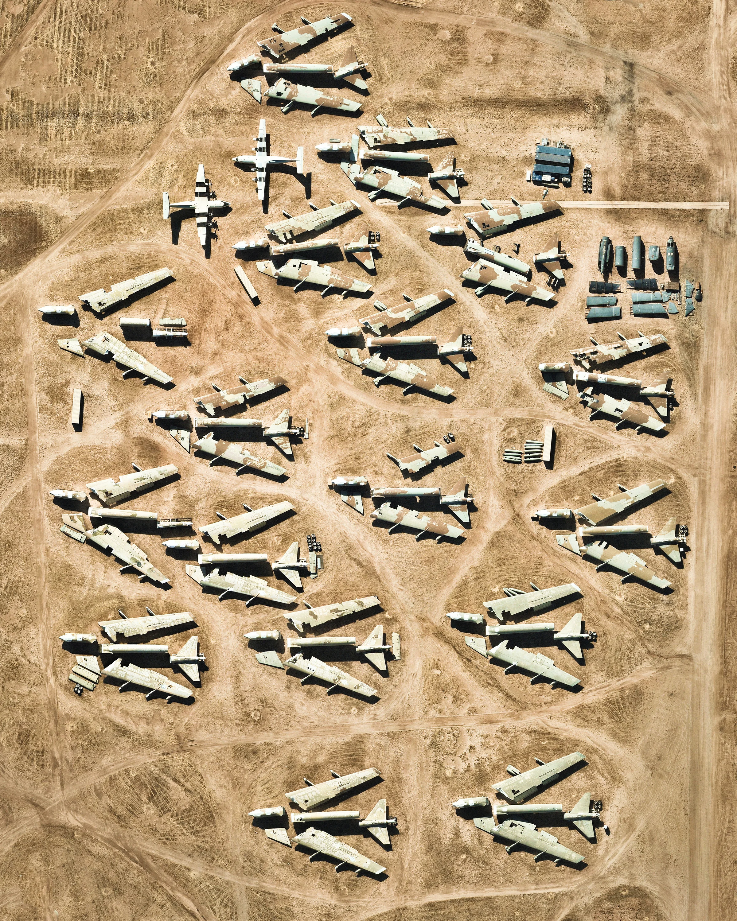 Disassembled airplanes sit in storage at the Davis-Monthan Air Force Base in Tucson, Arizona. These planes are among more than 4,400 retired American military and government aircraft being stored and preserved on-site by the 309th Aerospace Maintenance and Regeneration Group. Covering more than four square miles (10.5 km sq.), this facility is the largest of its kind in the world. 32°08'57.1"N, 110°49'58.1"W Source imagery: Nearmap