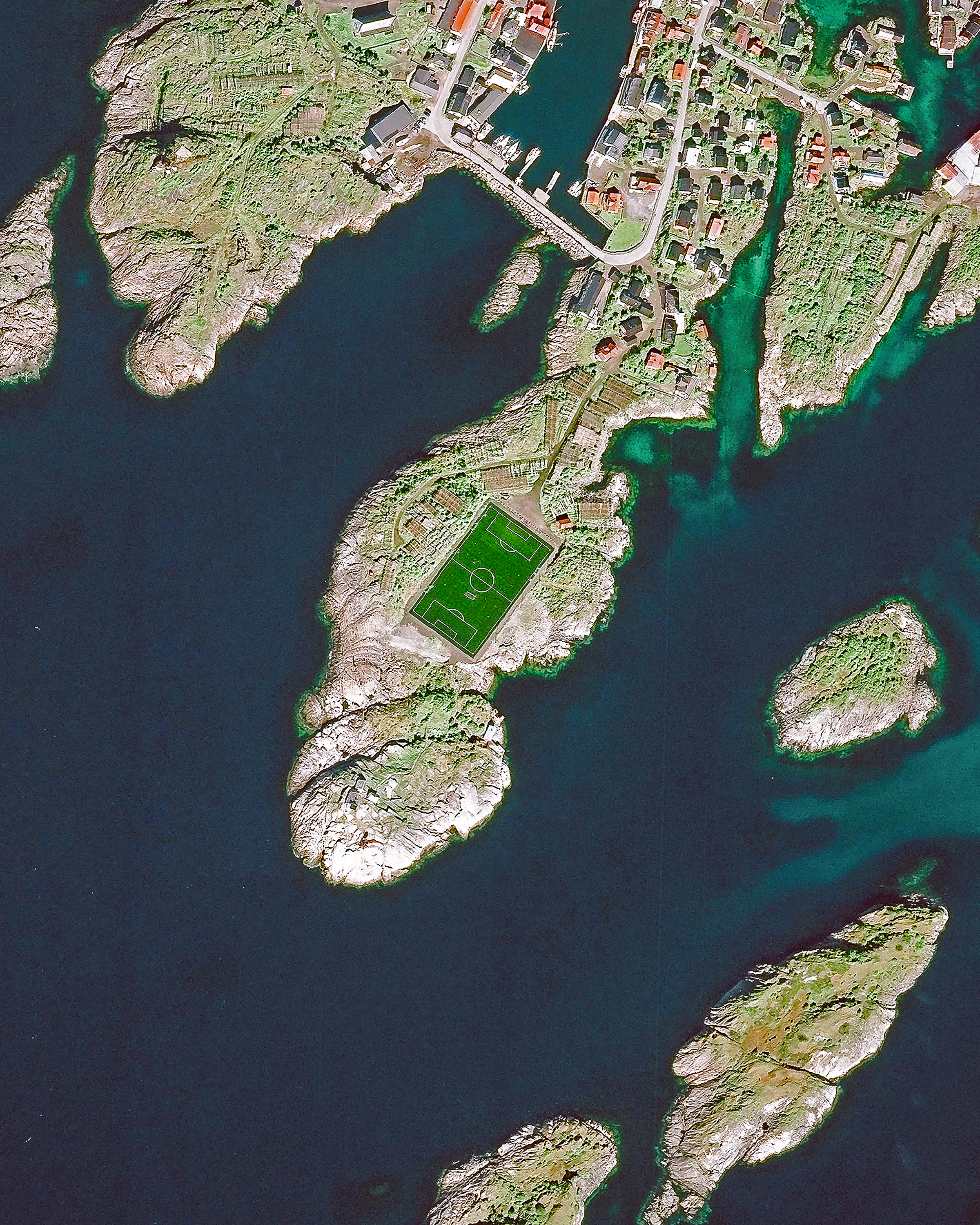 Check out this unique soccer pitch in Henningsvær, a fishing village located on several small islands in Norway’s Lofoten archipelago. Situated inside the Arctic Circle, this 74-acre (0.3 sq. km) village has a population of less than 500 people. Henningsvær is a popular tourist destination, attracting hikers, climbers, divers and snorkelers. 68°08'57.1"N, 14°12'07.7"E Source imagery: DigitalGlobe